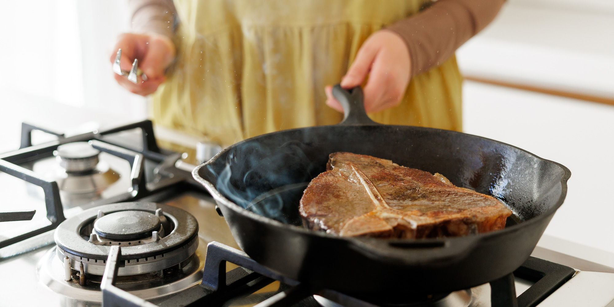 Cooking a steak on a cast iron pan