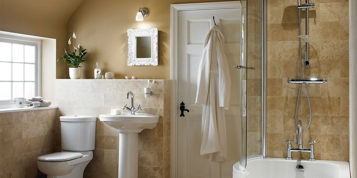 a more traditional bathroom with toilet, sink and bath shower.