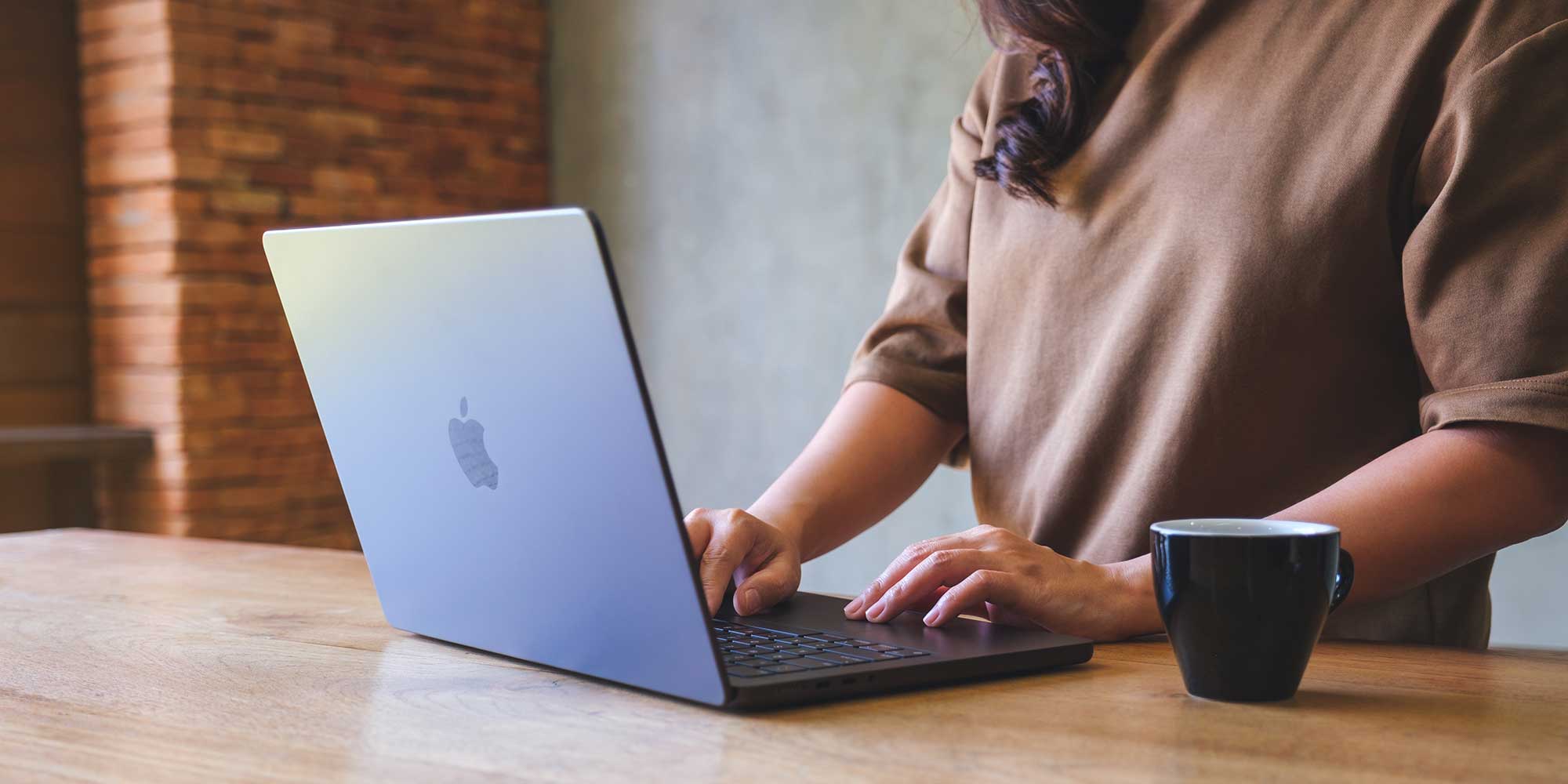 Typing on a laptop