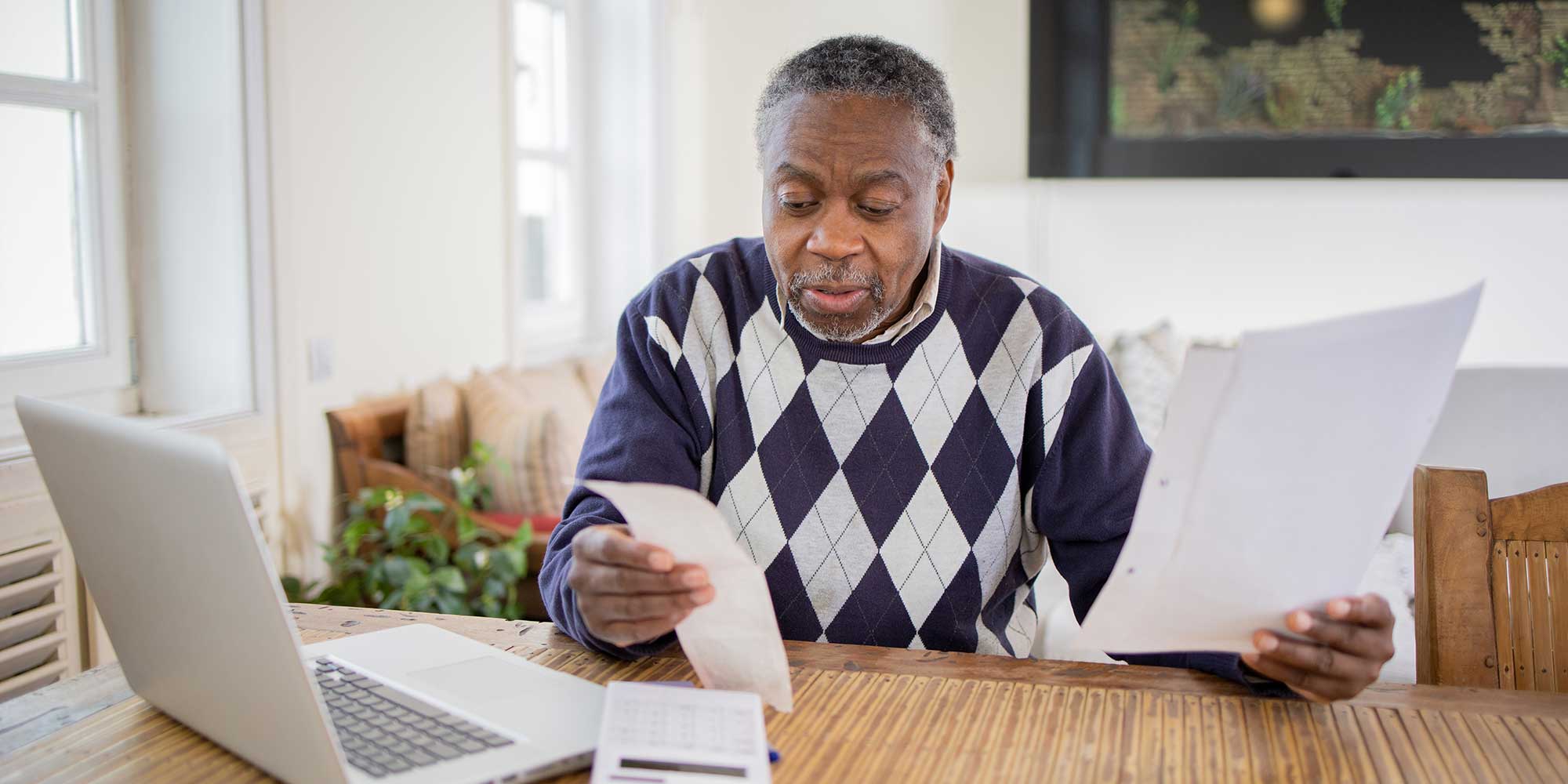 Man paying bills and budgeting
