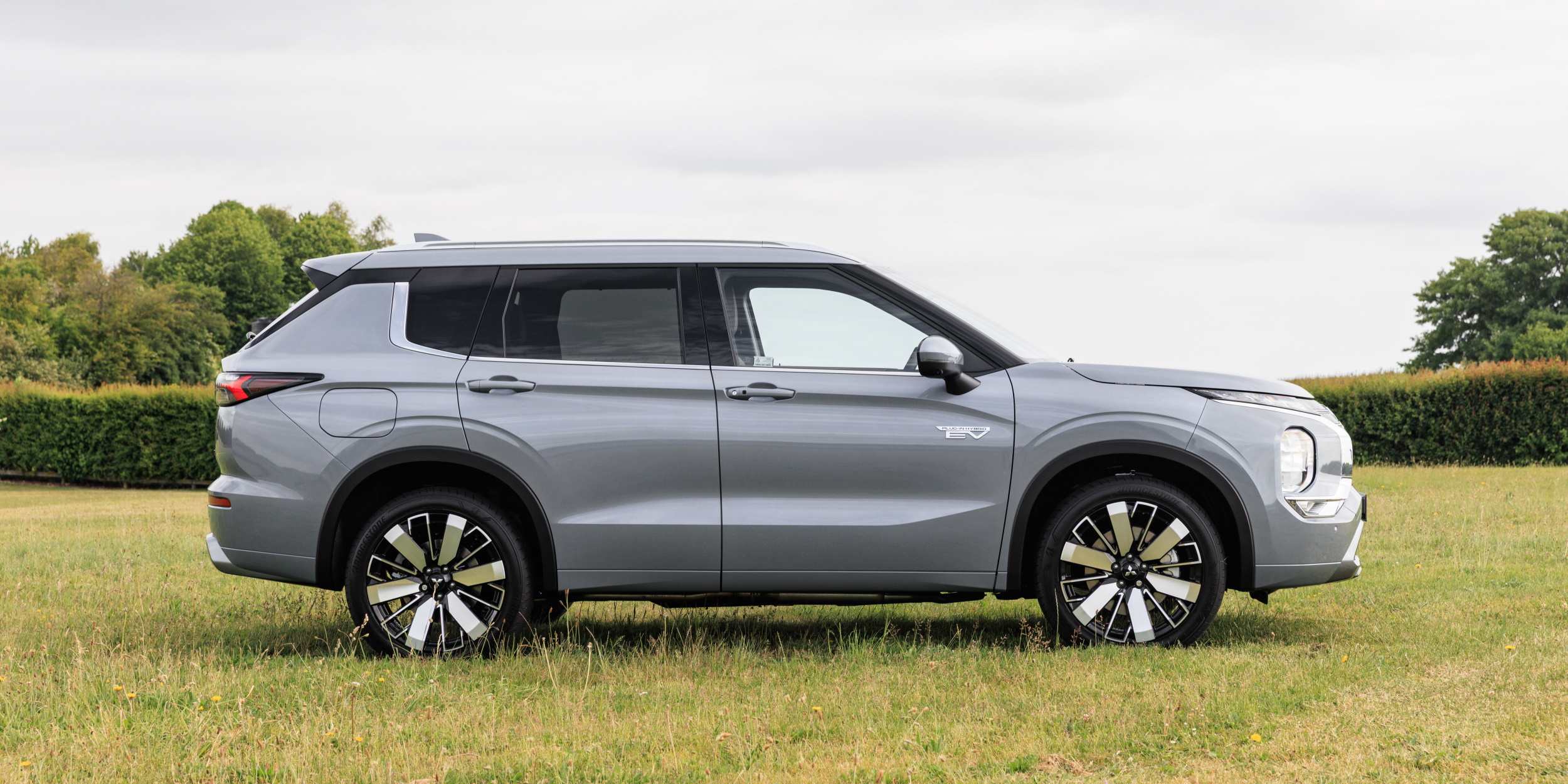 Mitsubishi Outlander PHEV - side profile in a field