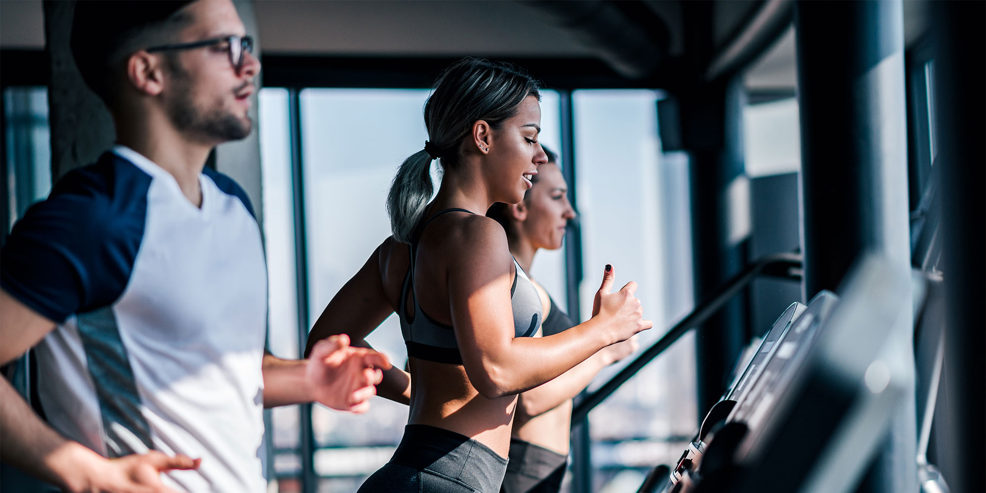 Runners on treadmills in a gym