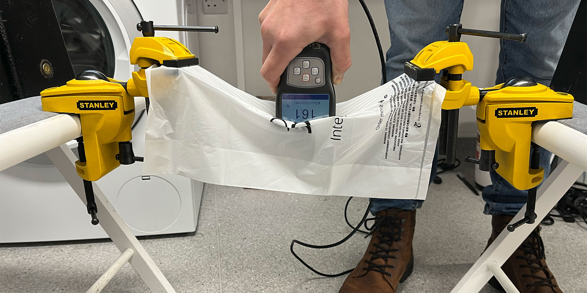 Testing food waste bag puncture resistance using a force gauge