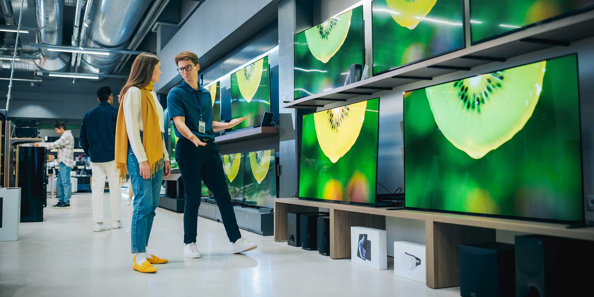 Person shopping for a new TV in store