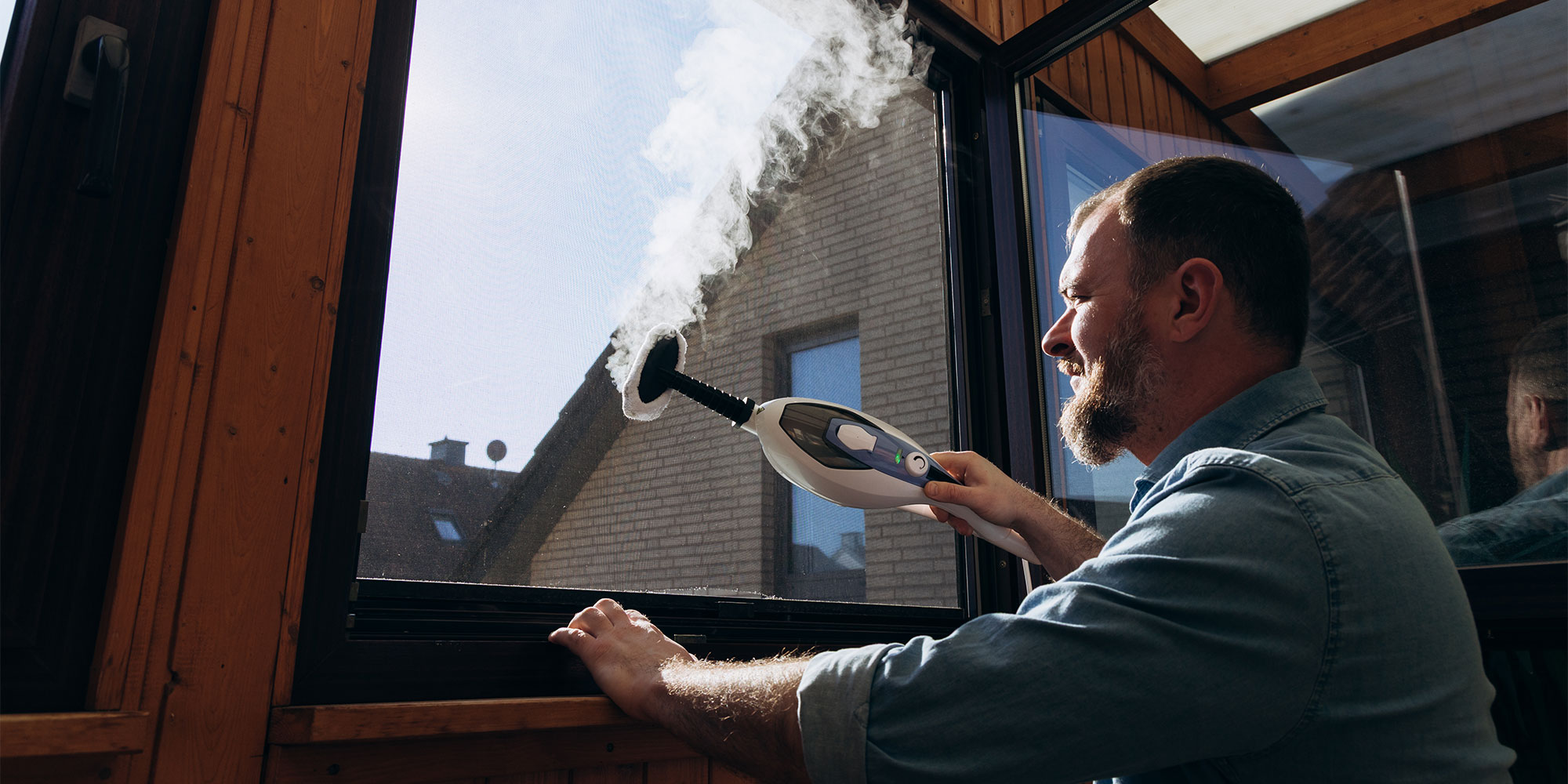 A 2-in-1 steam mop in handheld mode.