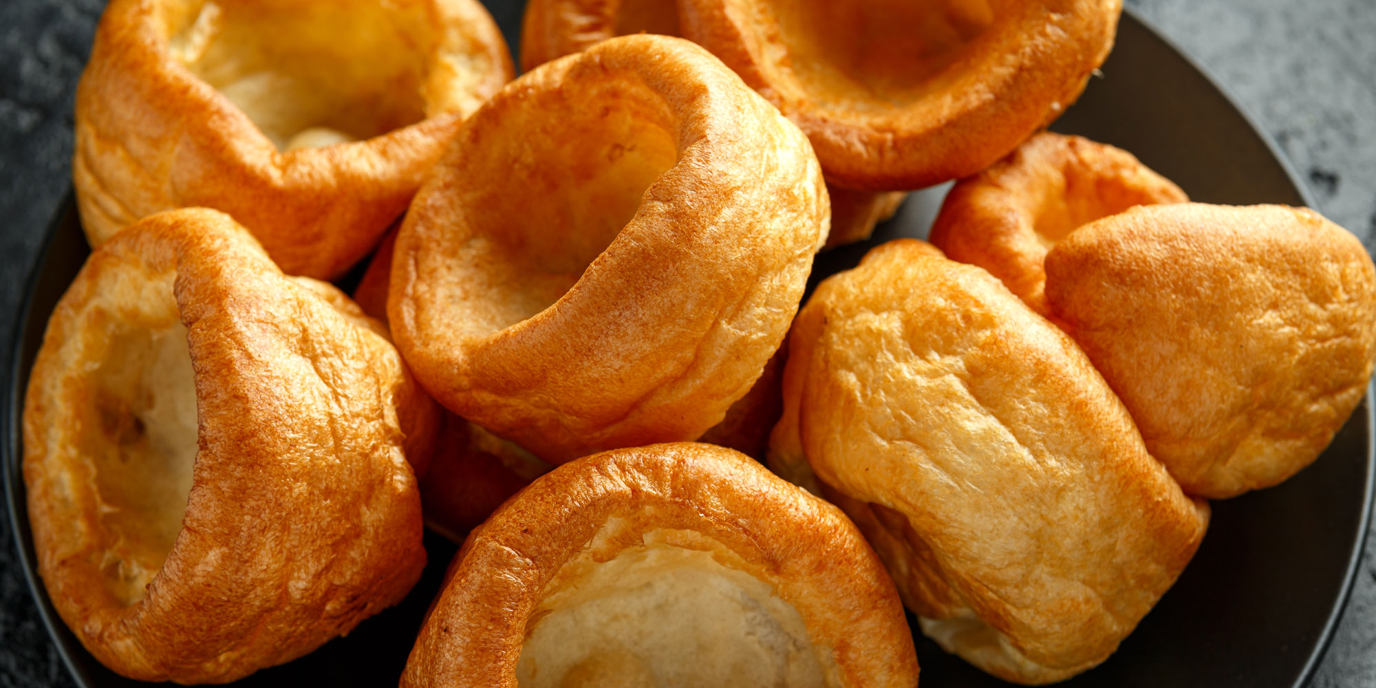 Close up of a few Yorkshire puddings on a plate