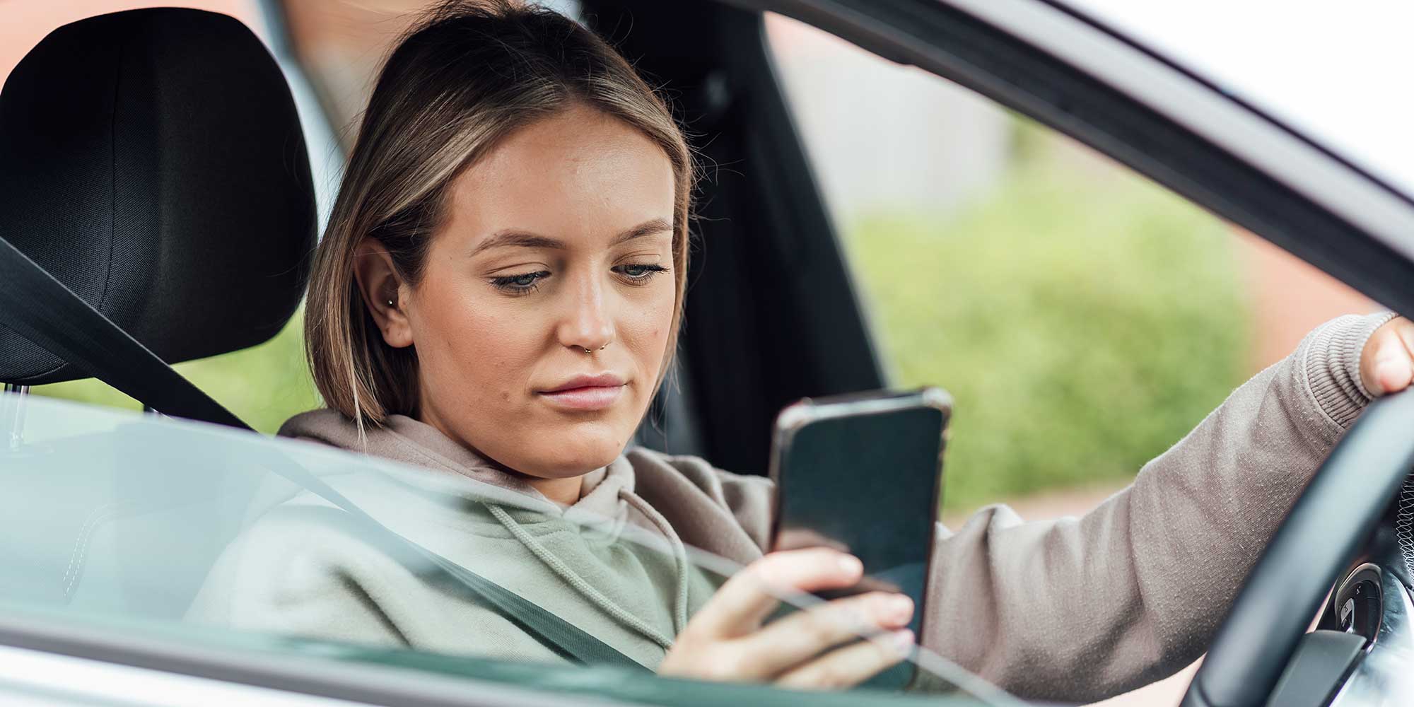 Woman using a mobile phone while driving