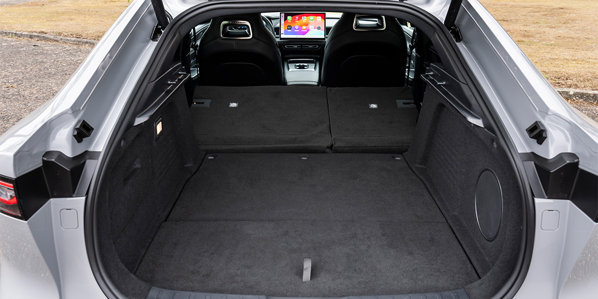 The boot of the Mazda 6e, with the rear seats folded away