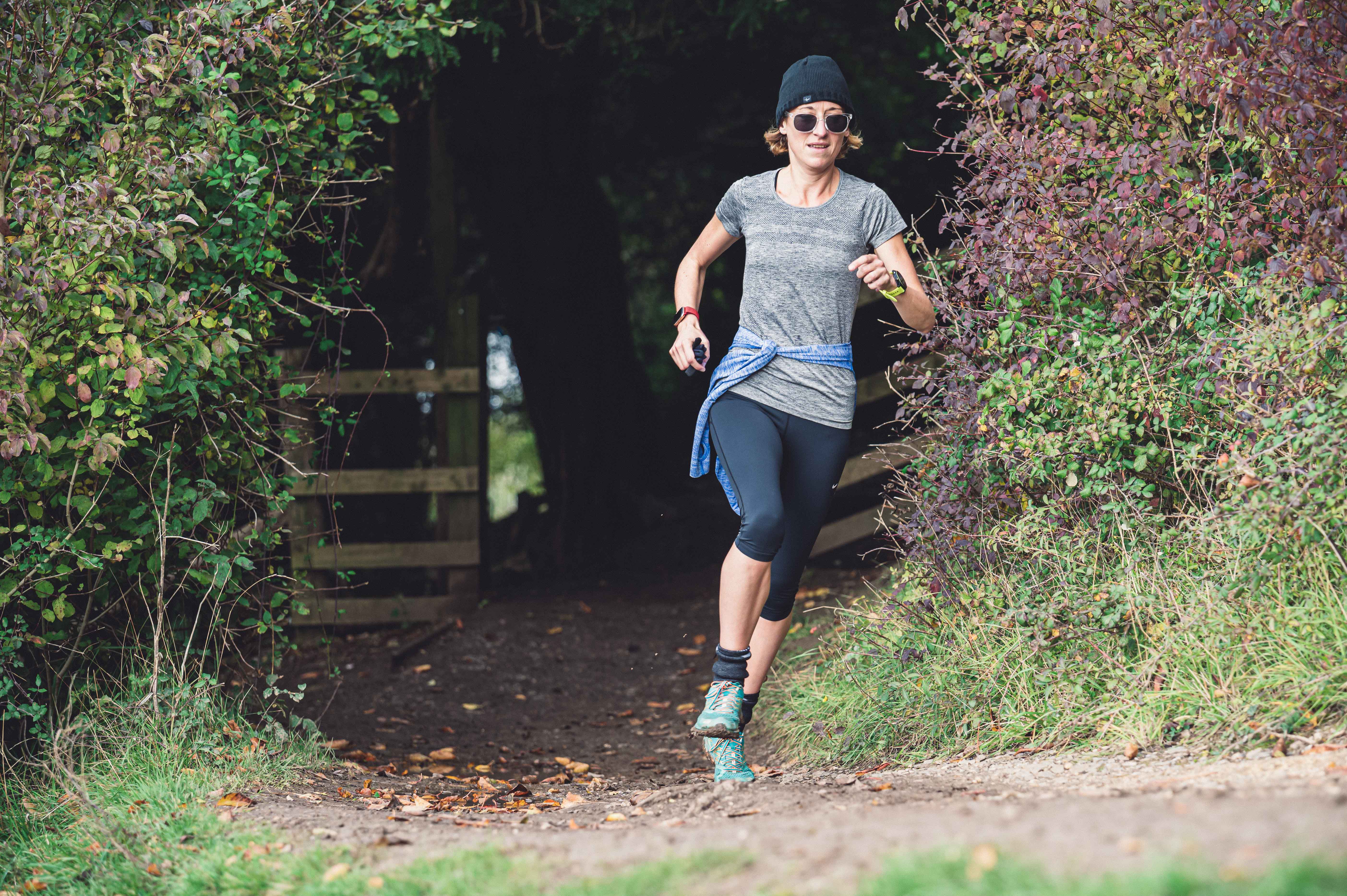 Kate Carter running in a rural setting