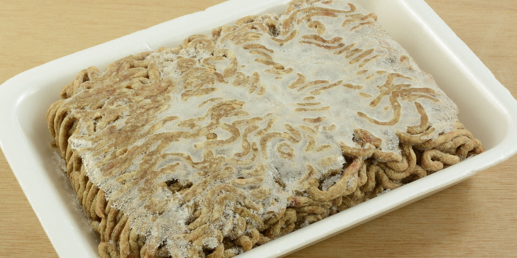 Freezer burned mince in a Styrofoam tray