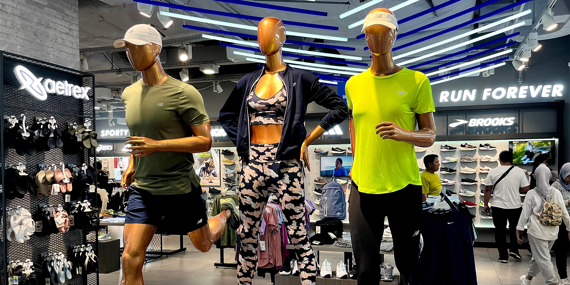 Running clothes on display in a store