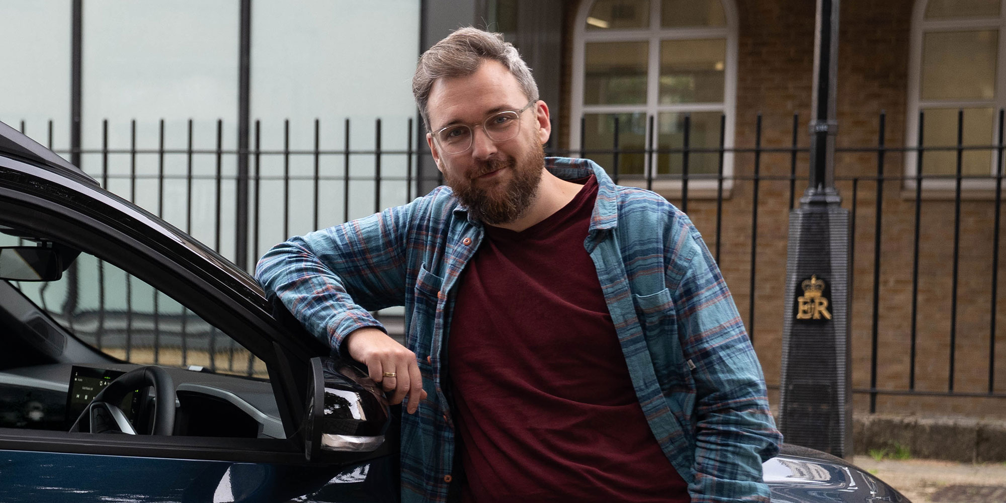 Michael Passingham next to a car