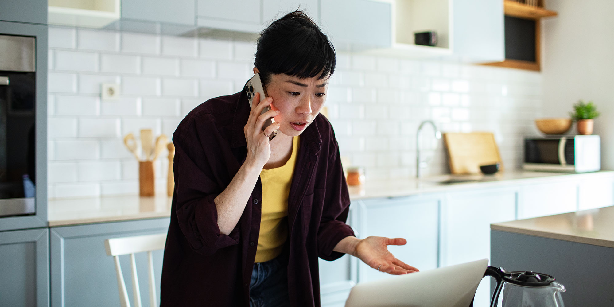 woman on the phone in the kitchen