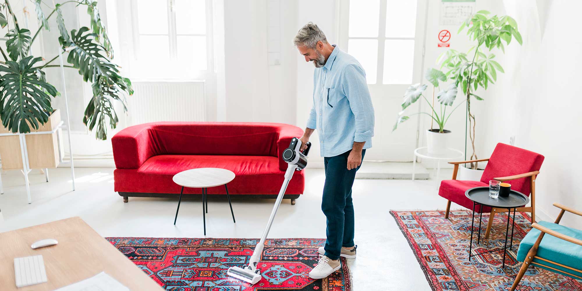 Best Buys: A man is using a vacuum cleaner