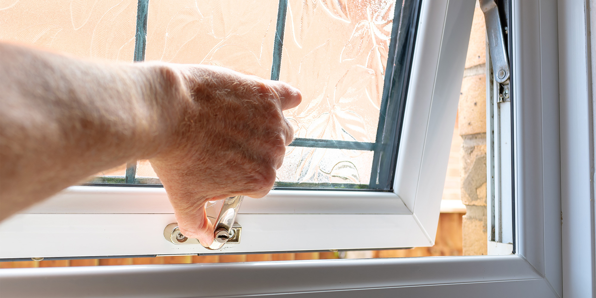 Someone opening a bathroom window