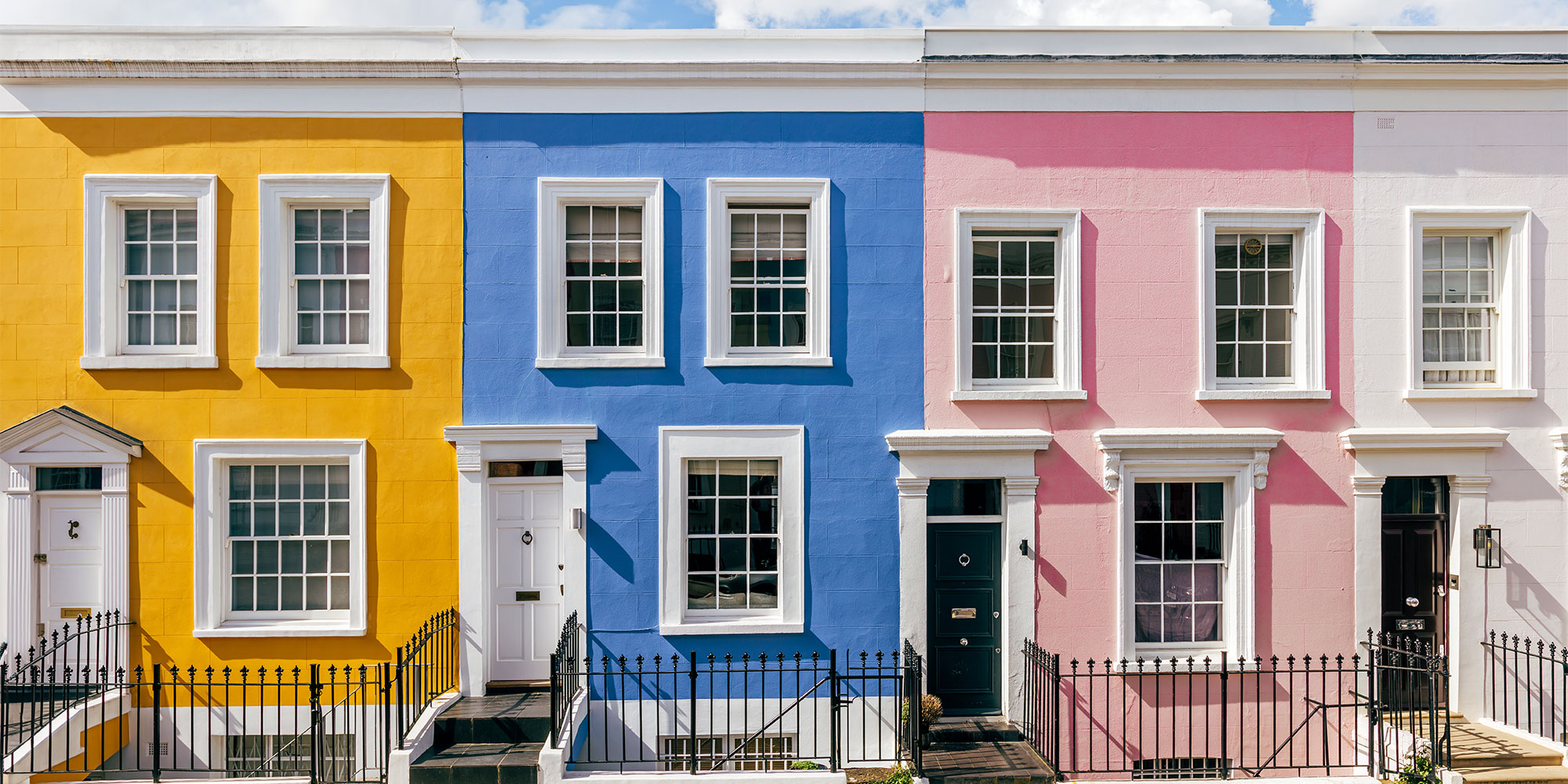 Brightly coloured houses in a row
