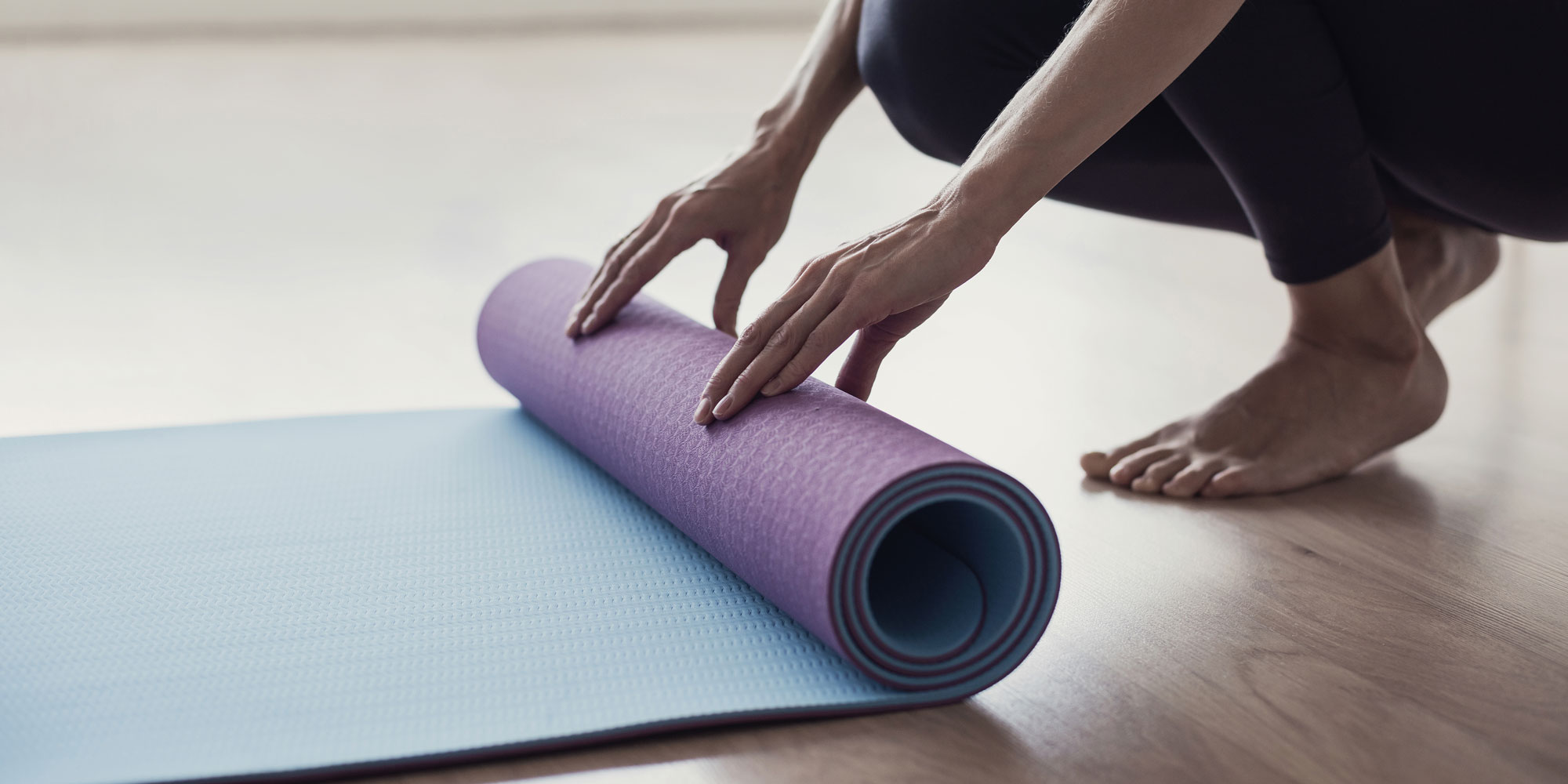 Yoga mat being rolled up