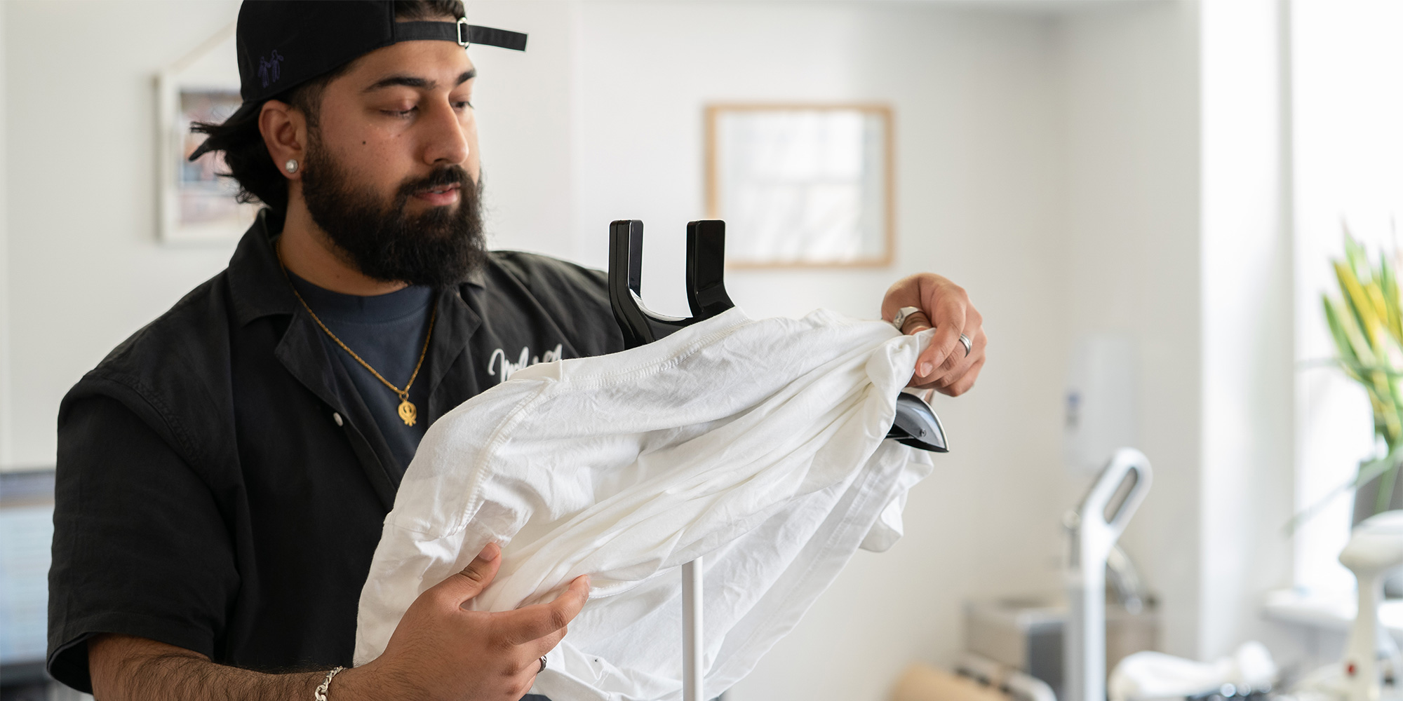 Our tester putting the creased garment on a hanger before steaming.