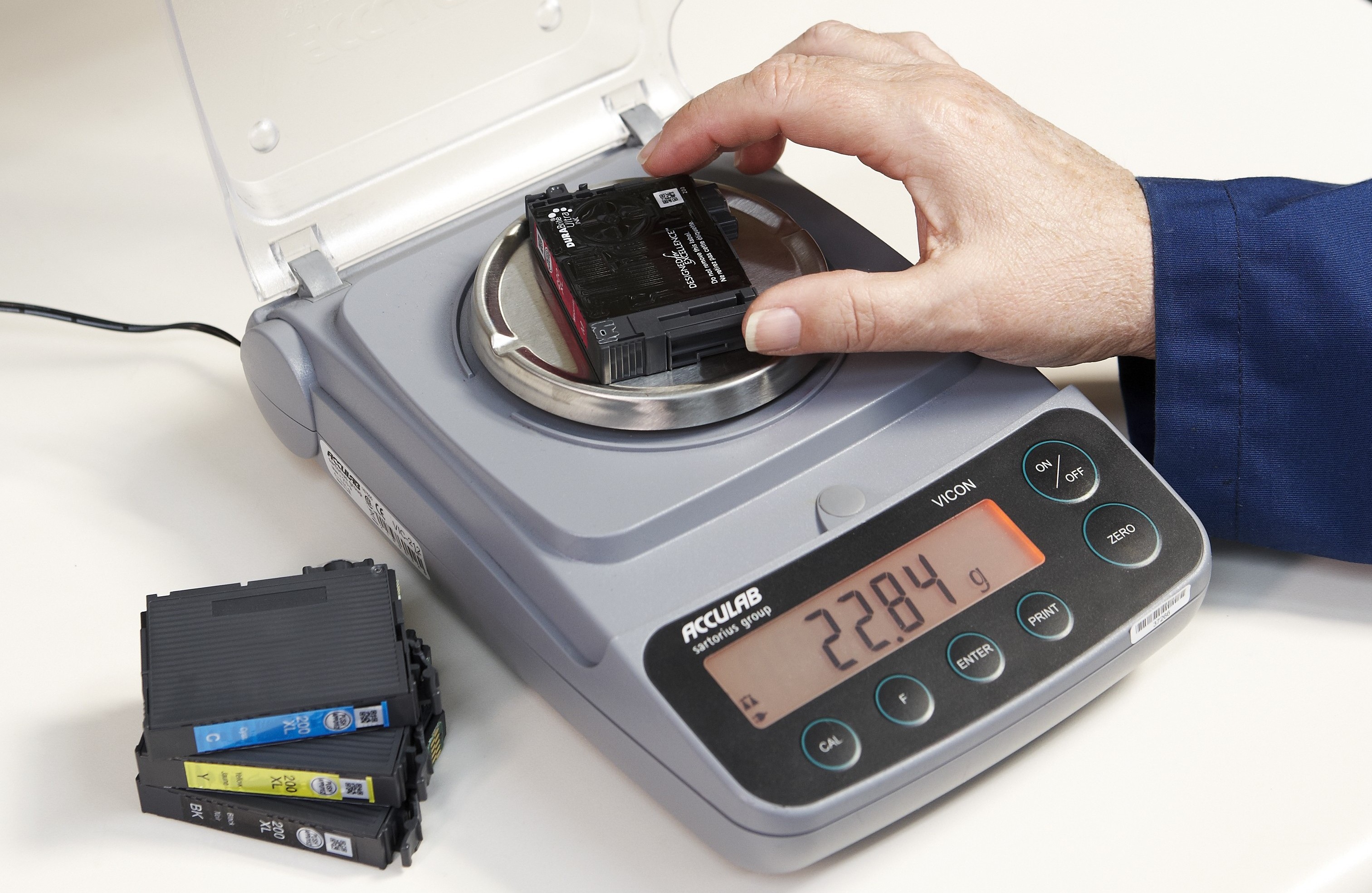Weighing printer ink cartridges