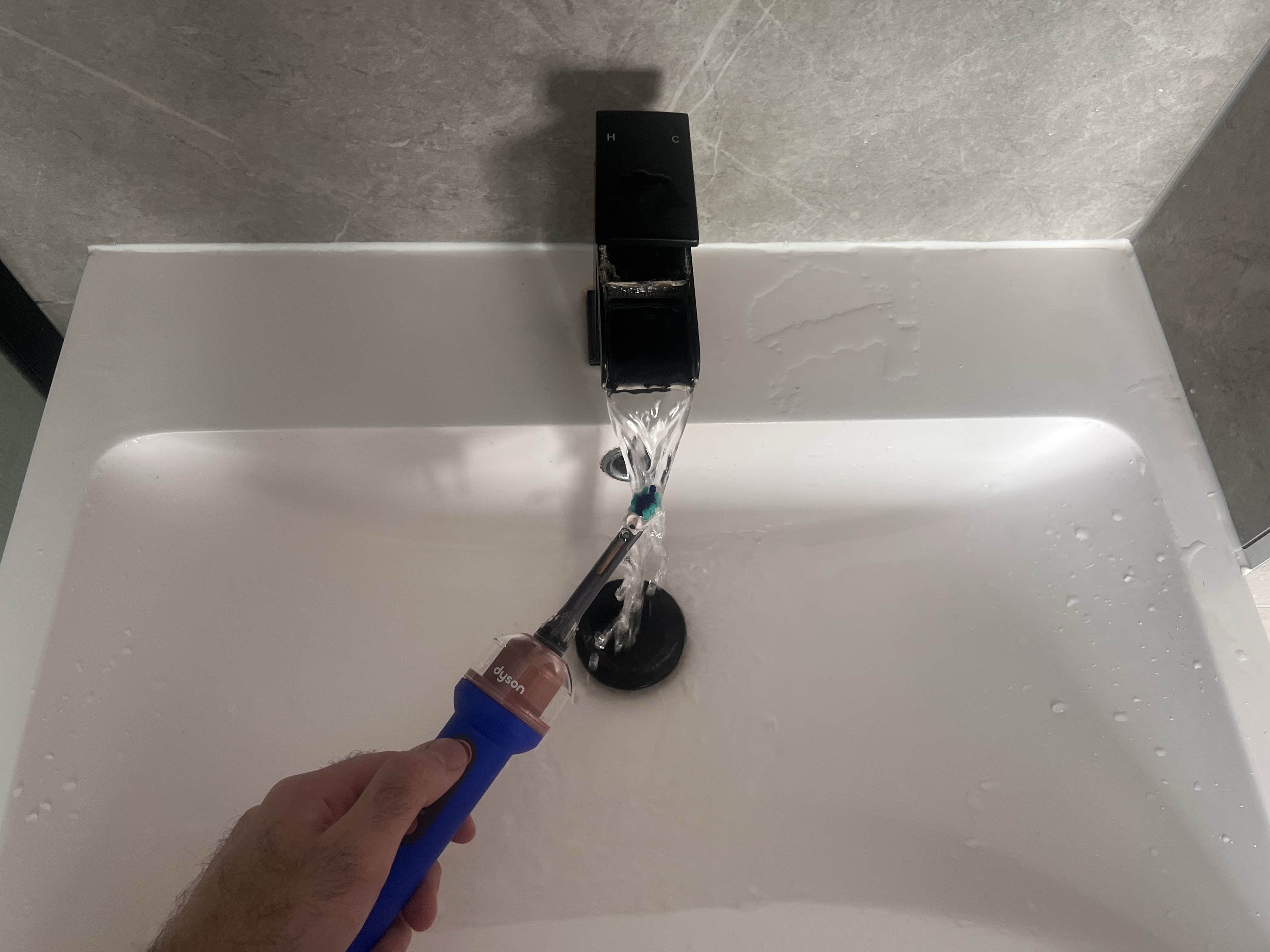 Finn using the Dyson CameraJet toothbrush
