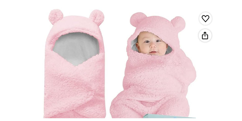 Baby lying in a potentially unsafe sleeping bag with hood