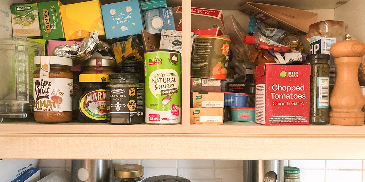 Cluttered kitchen cabinet