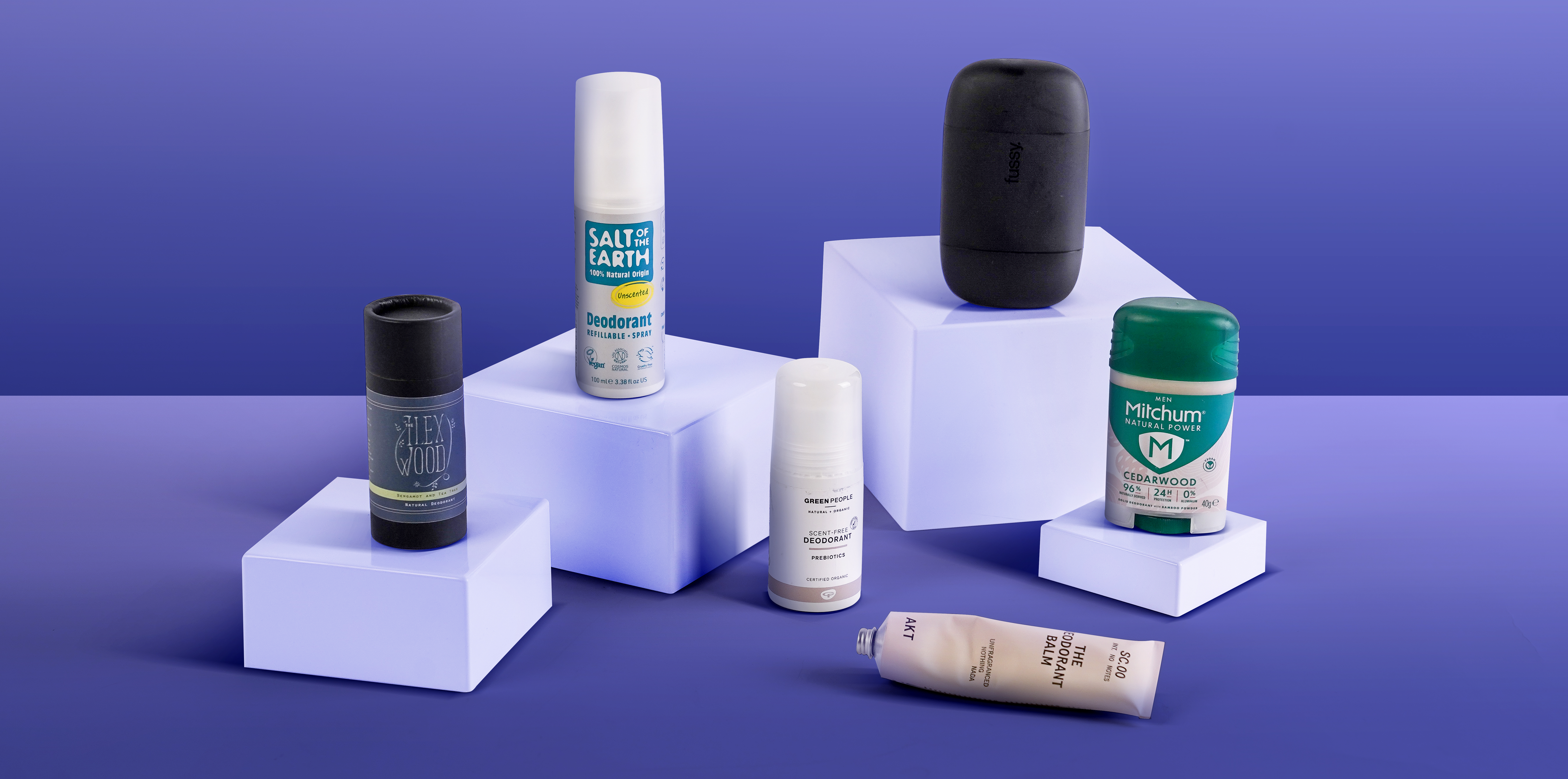six deodorants on a lilac background