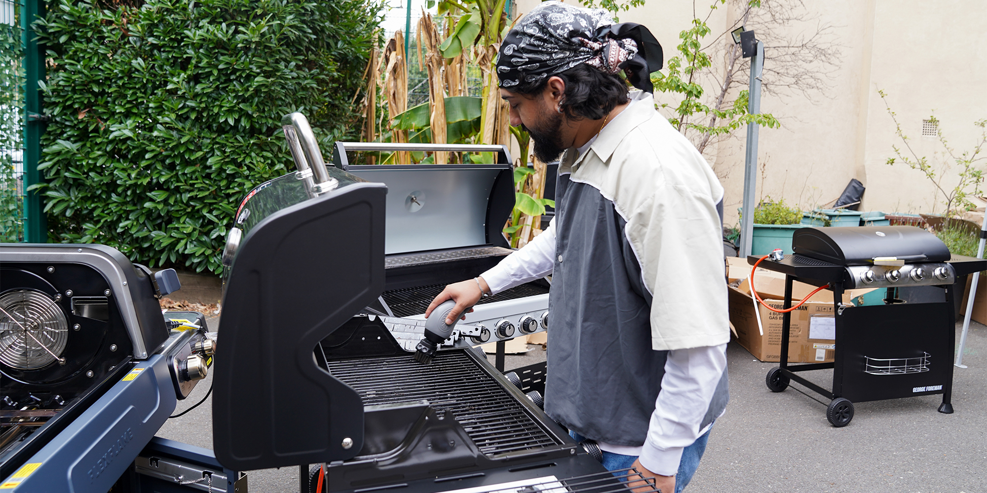 Tester cleaning a BBQ
