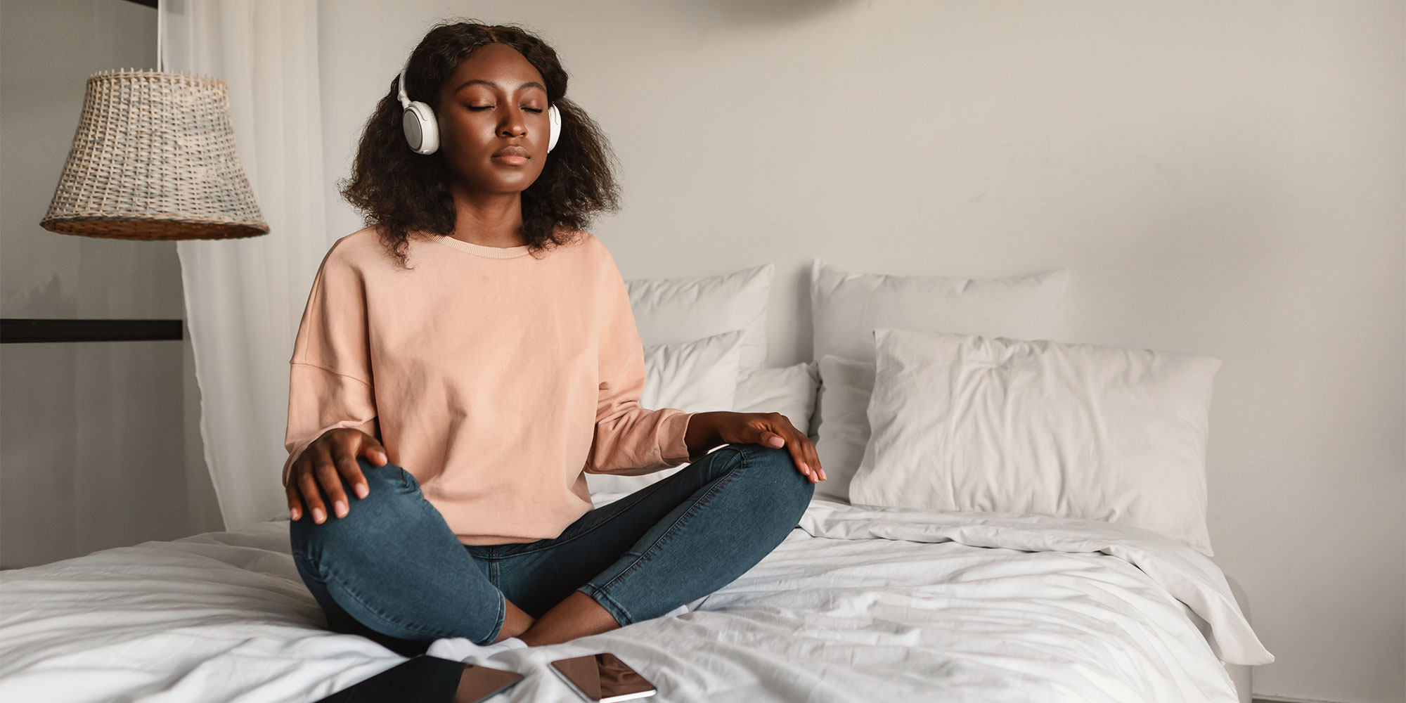 Woman meditating on bed