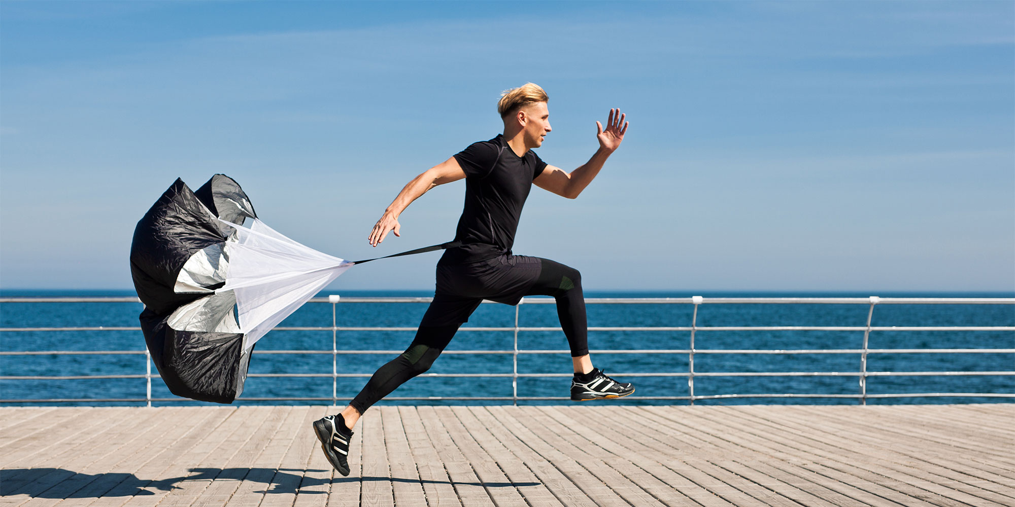 Running with resistance parachute for 'wind sprints'