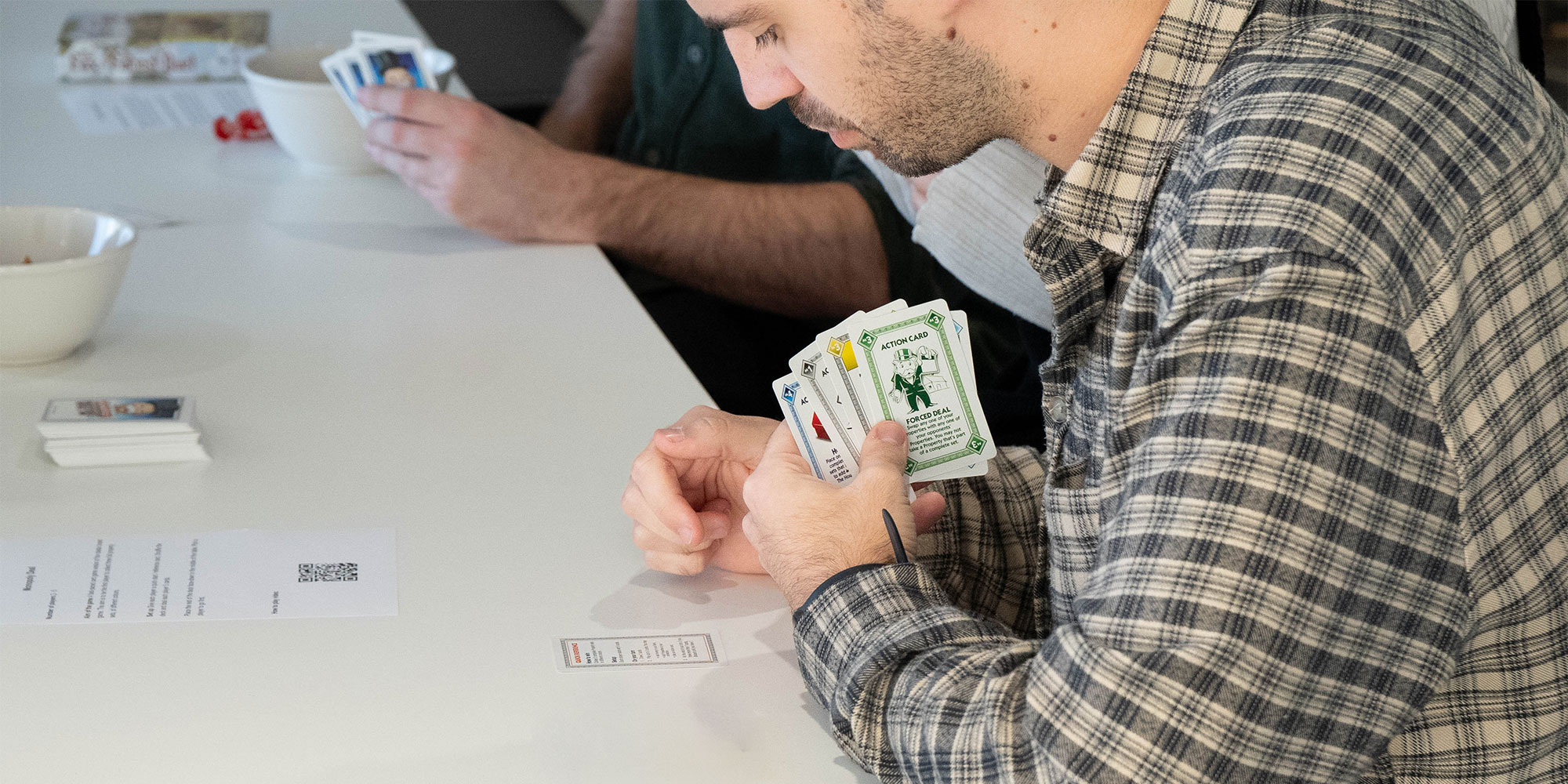 The Which? testing panel playing Monopoly Deal.