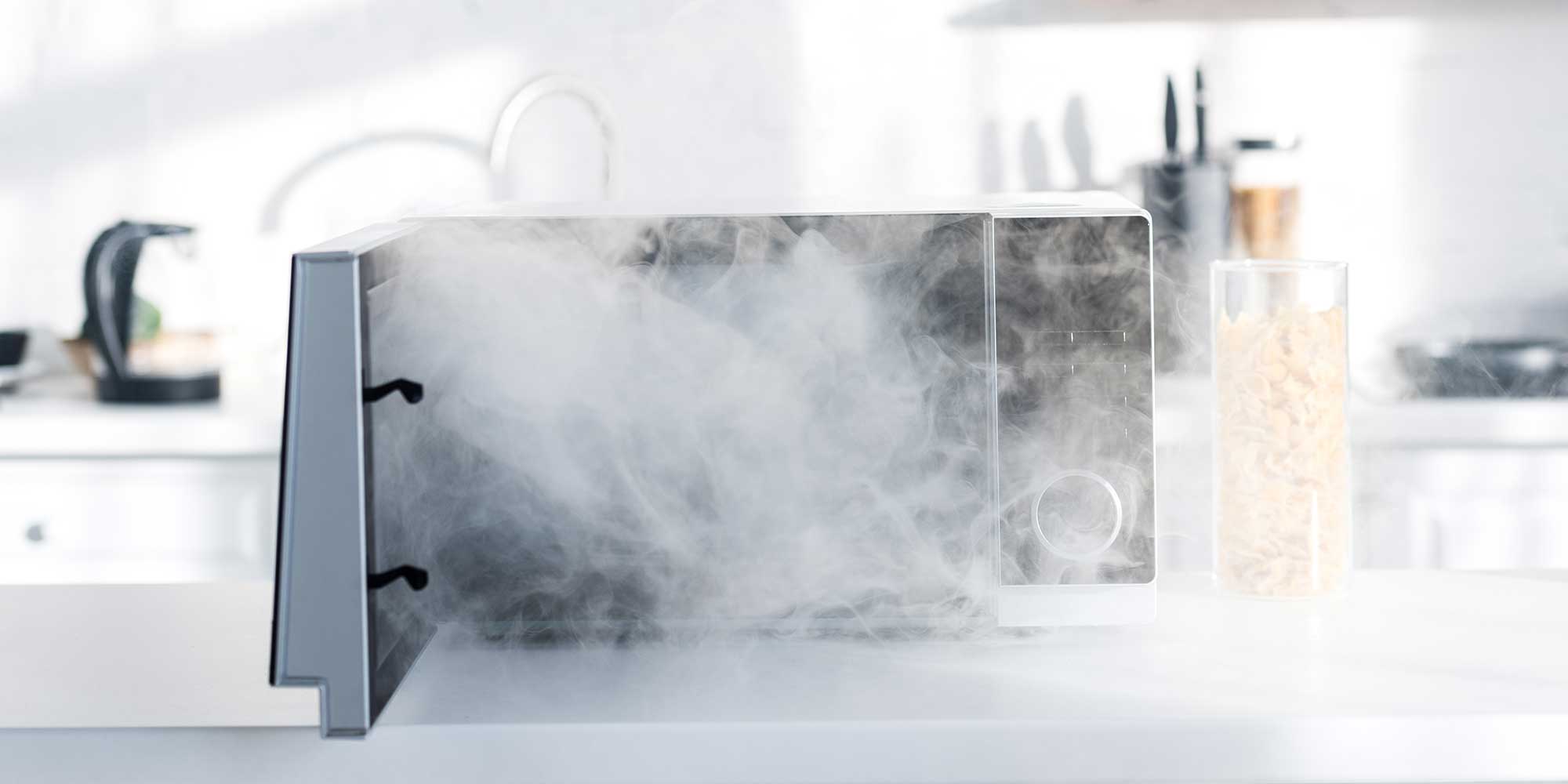 A microwave with smoke coming out of it