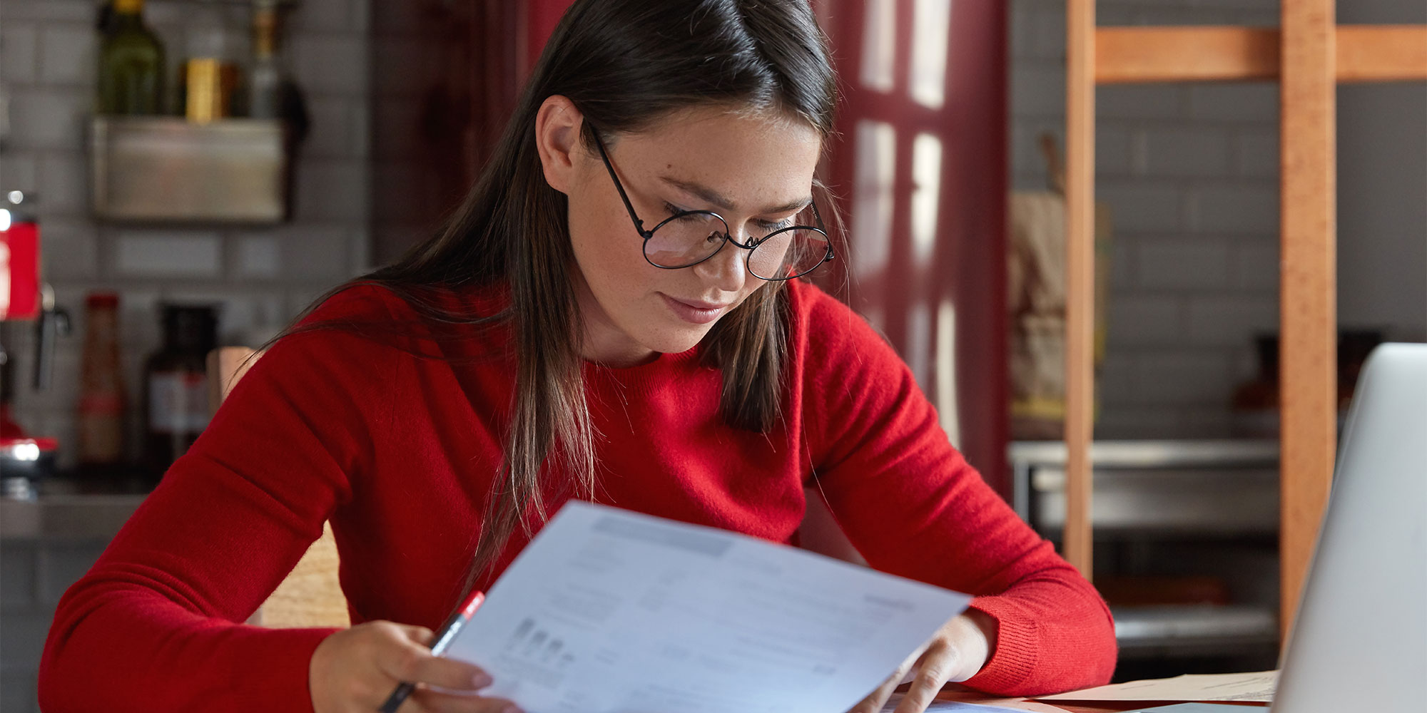 Woman reviewing a paper guarantee