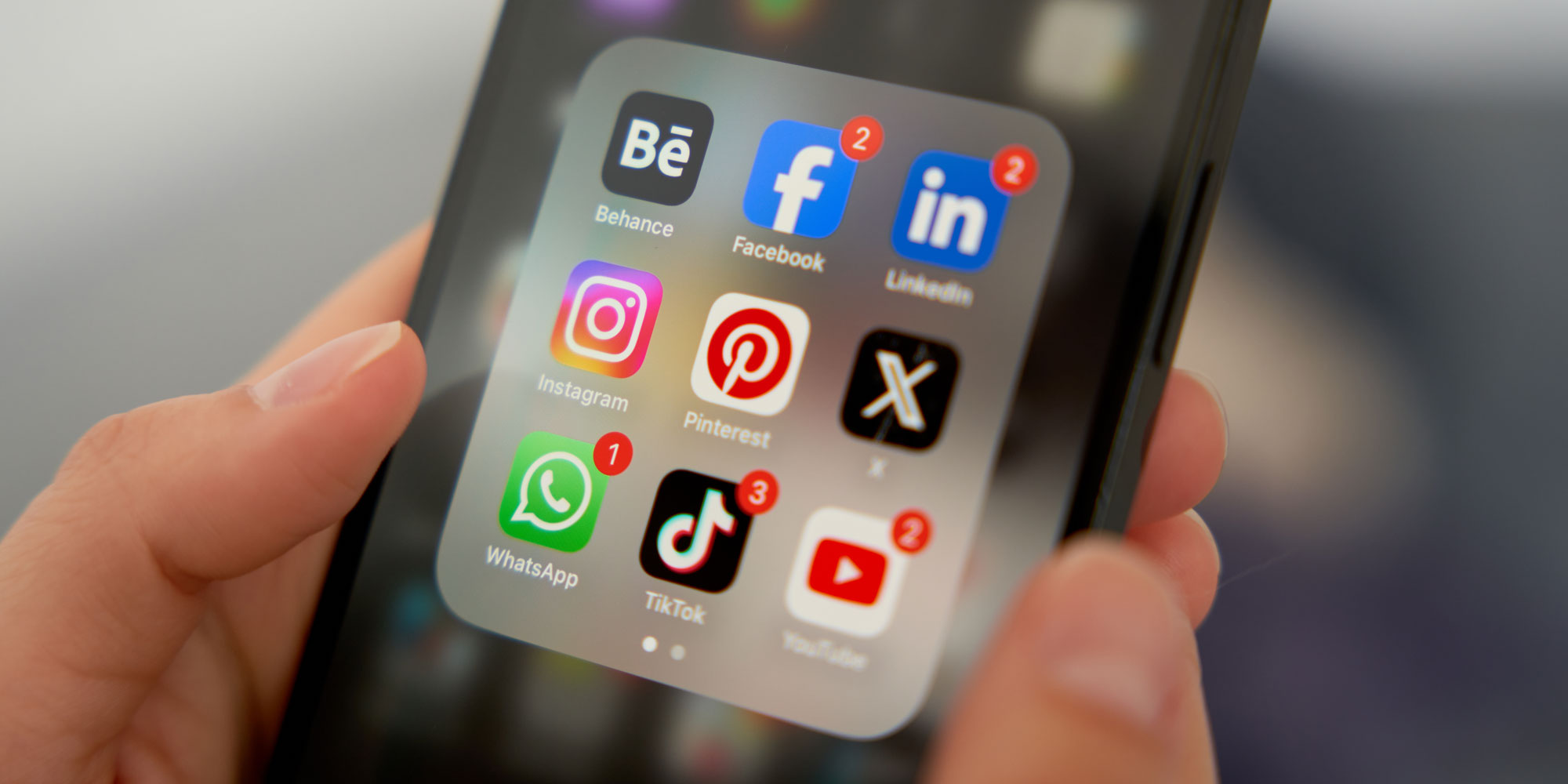 Social media app icons on a smartphone screen