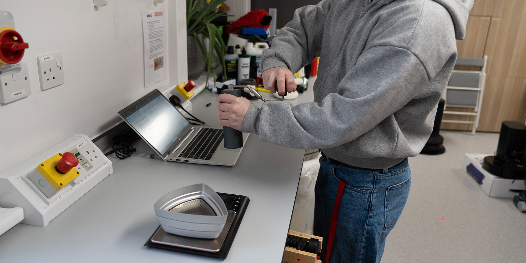 Which? tester grinding coffee granules