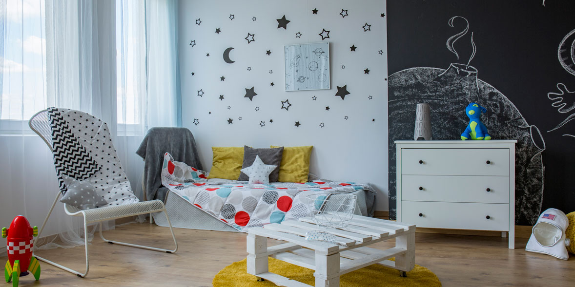 Bedroom with space-themed wall decals