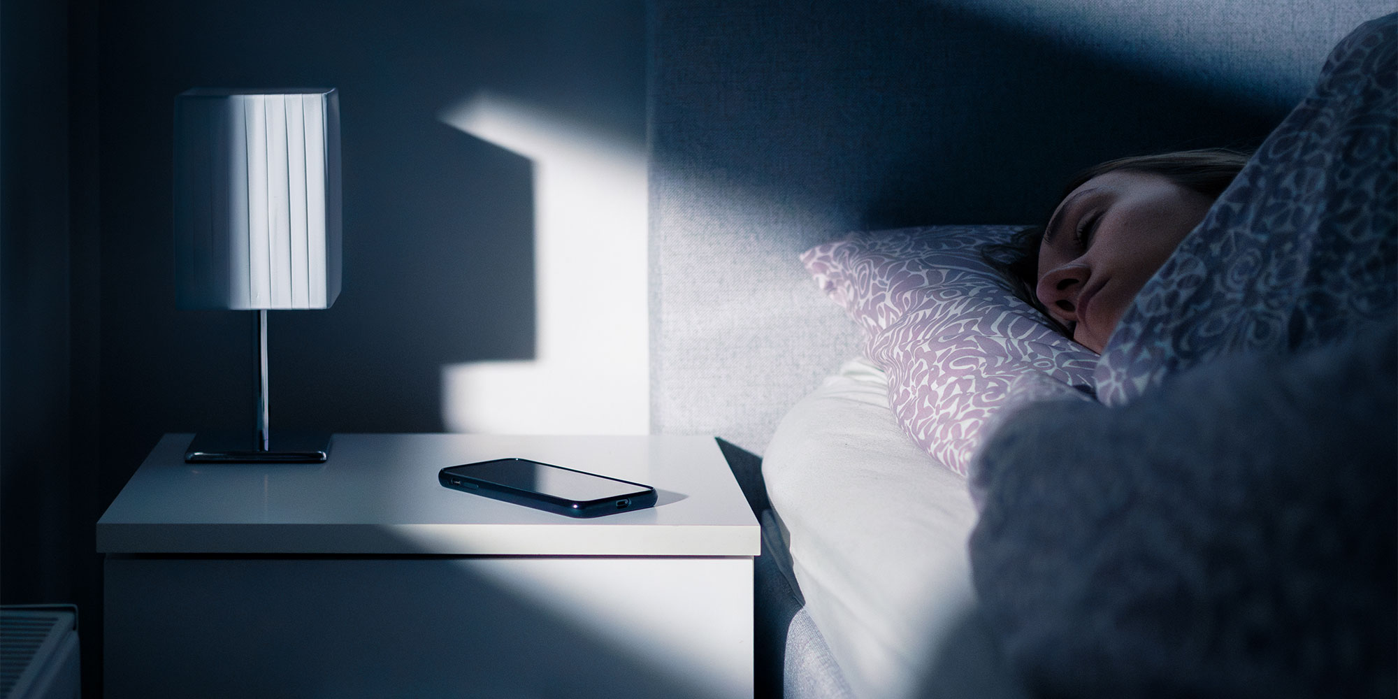 Phone next to someone sleeping