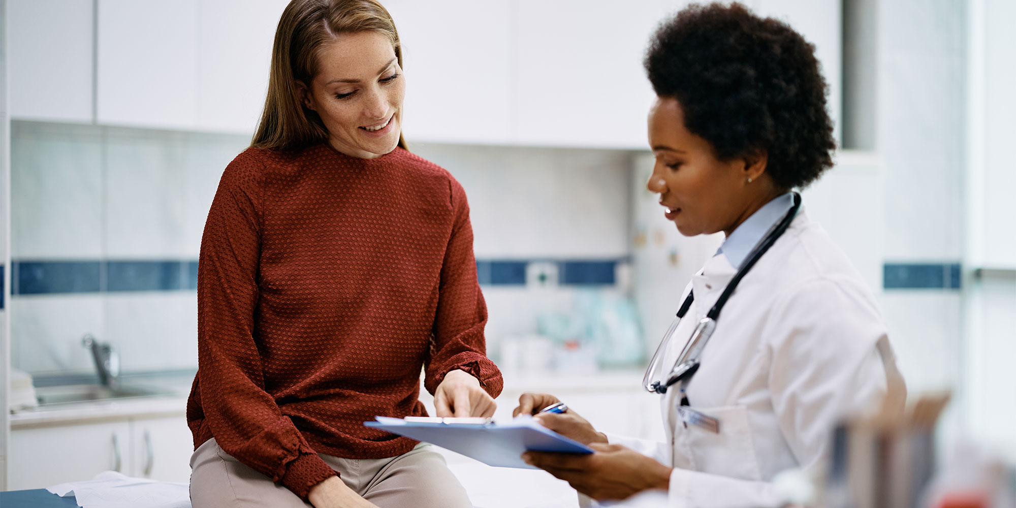 Woman speaking to a doctor in a hospital