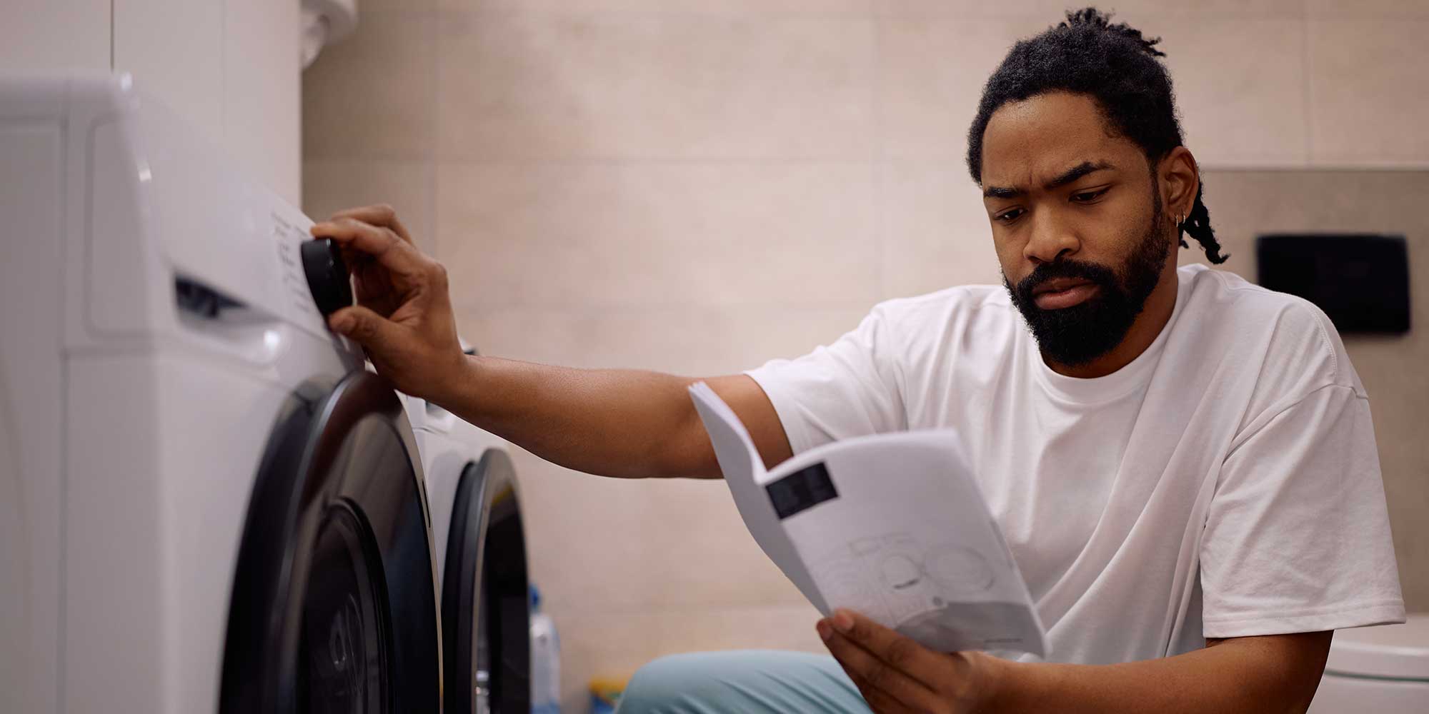 Man reading instruction manual