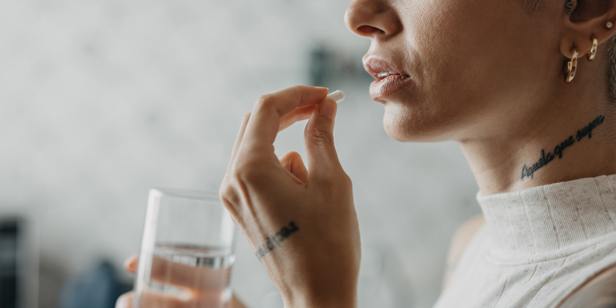 woman taking probiotic 