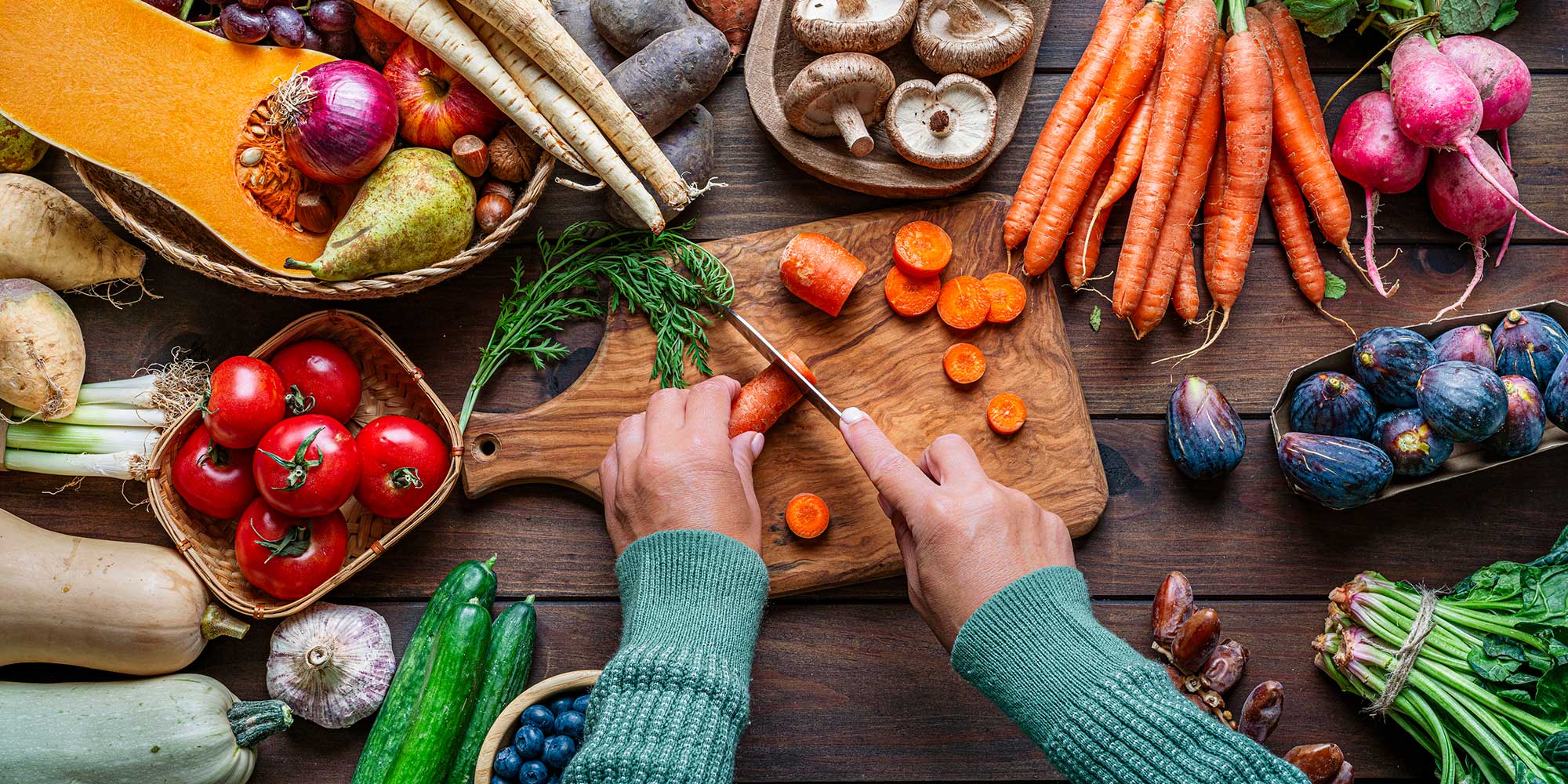 Kitchen knife chopping a range of fruit and vegetables