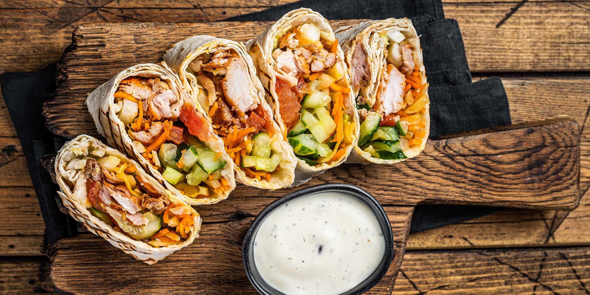 Wholegrain wrap with cucumber and chicken