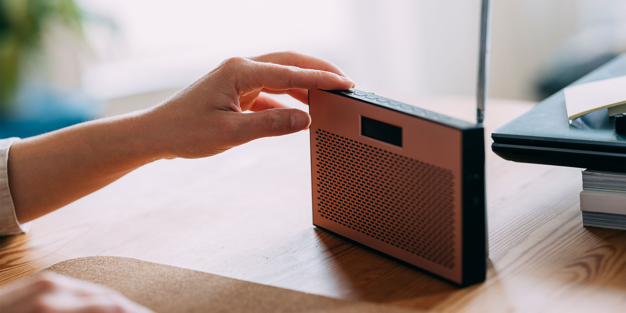 hand touching radio