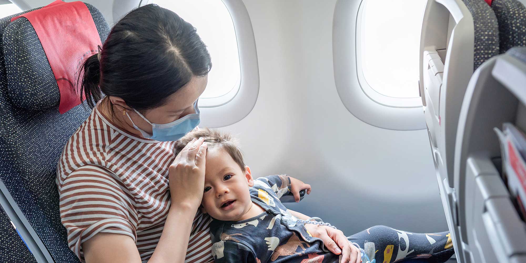 Baby looking unwell on a plane