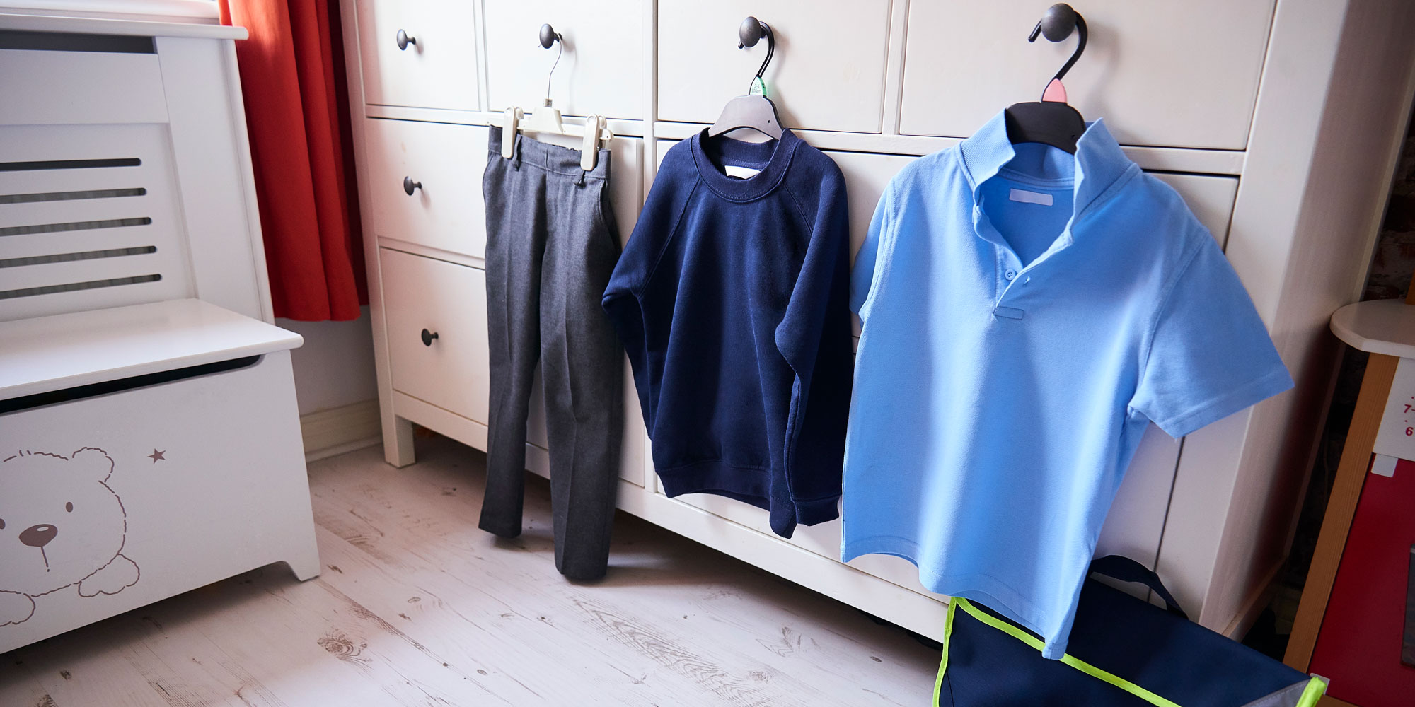 Uniform hung on the outside of a wardrobe