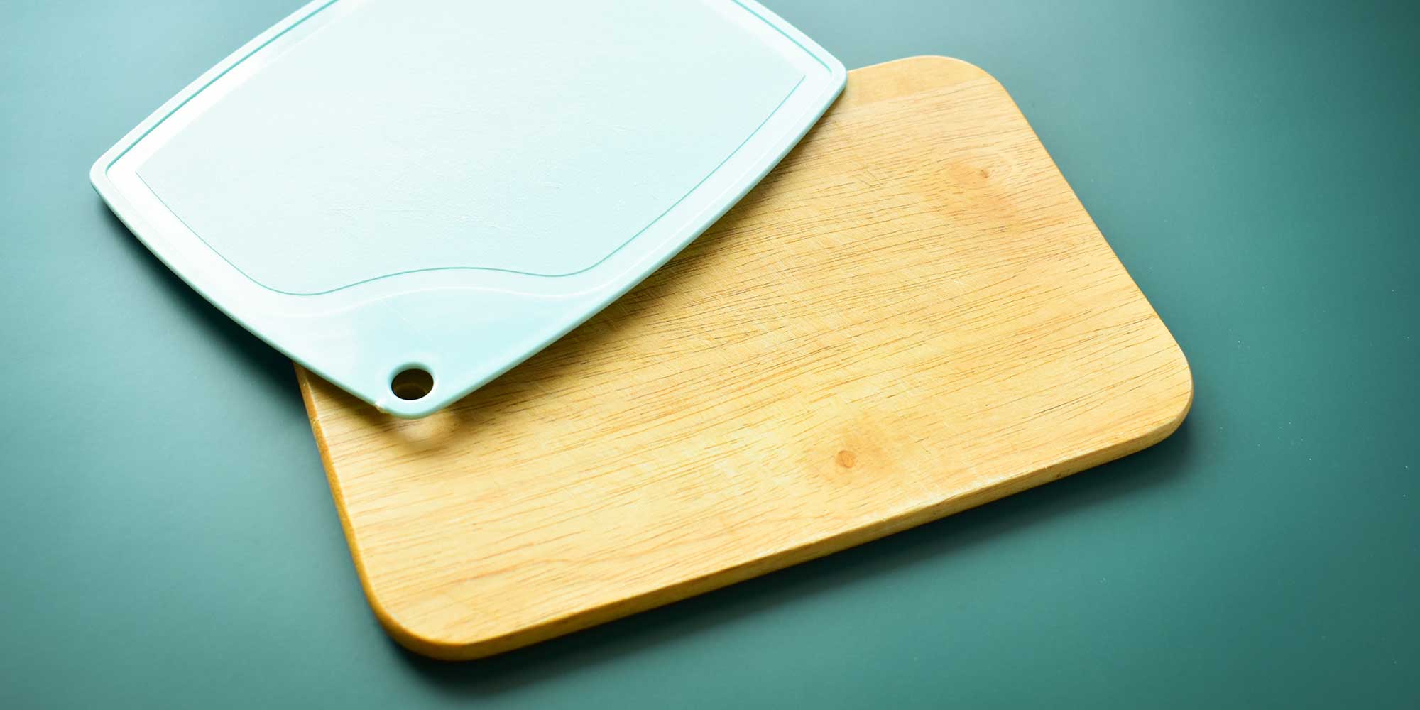 Plastic and wooden chopping boards