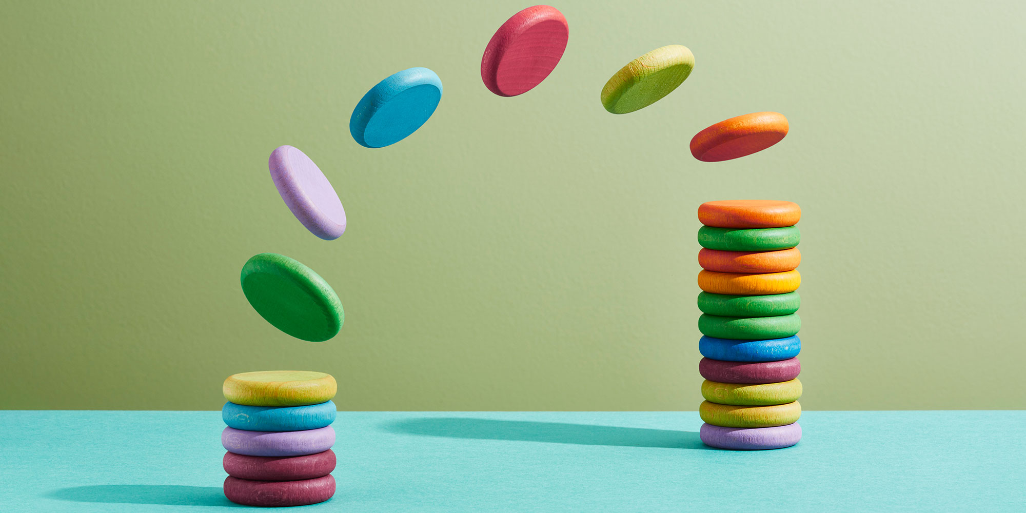 Colourful discs flipping from one stack to another