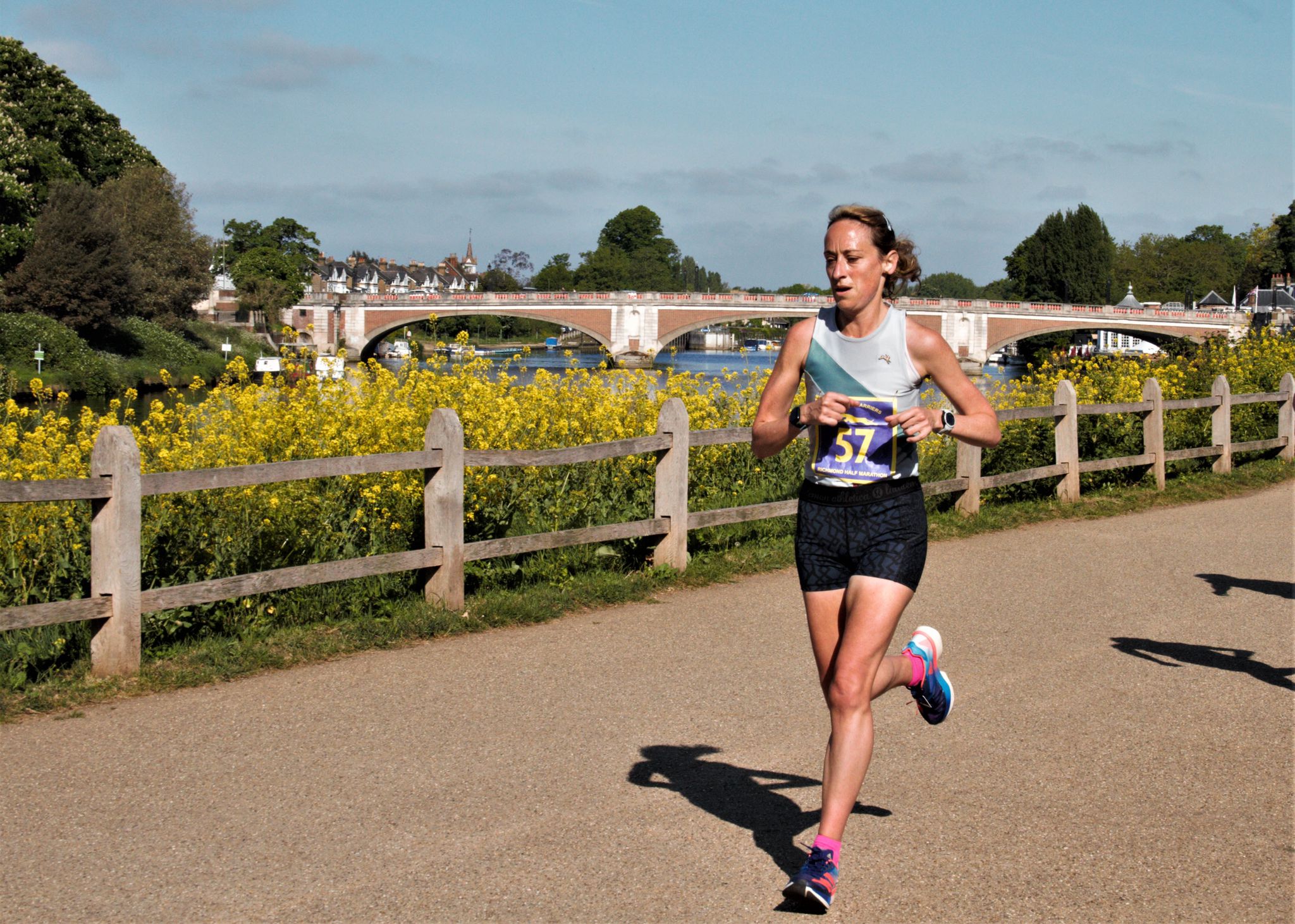 Kate Carter running along the Thames in a race