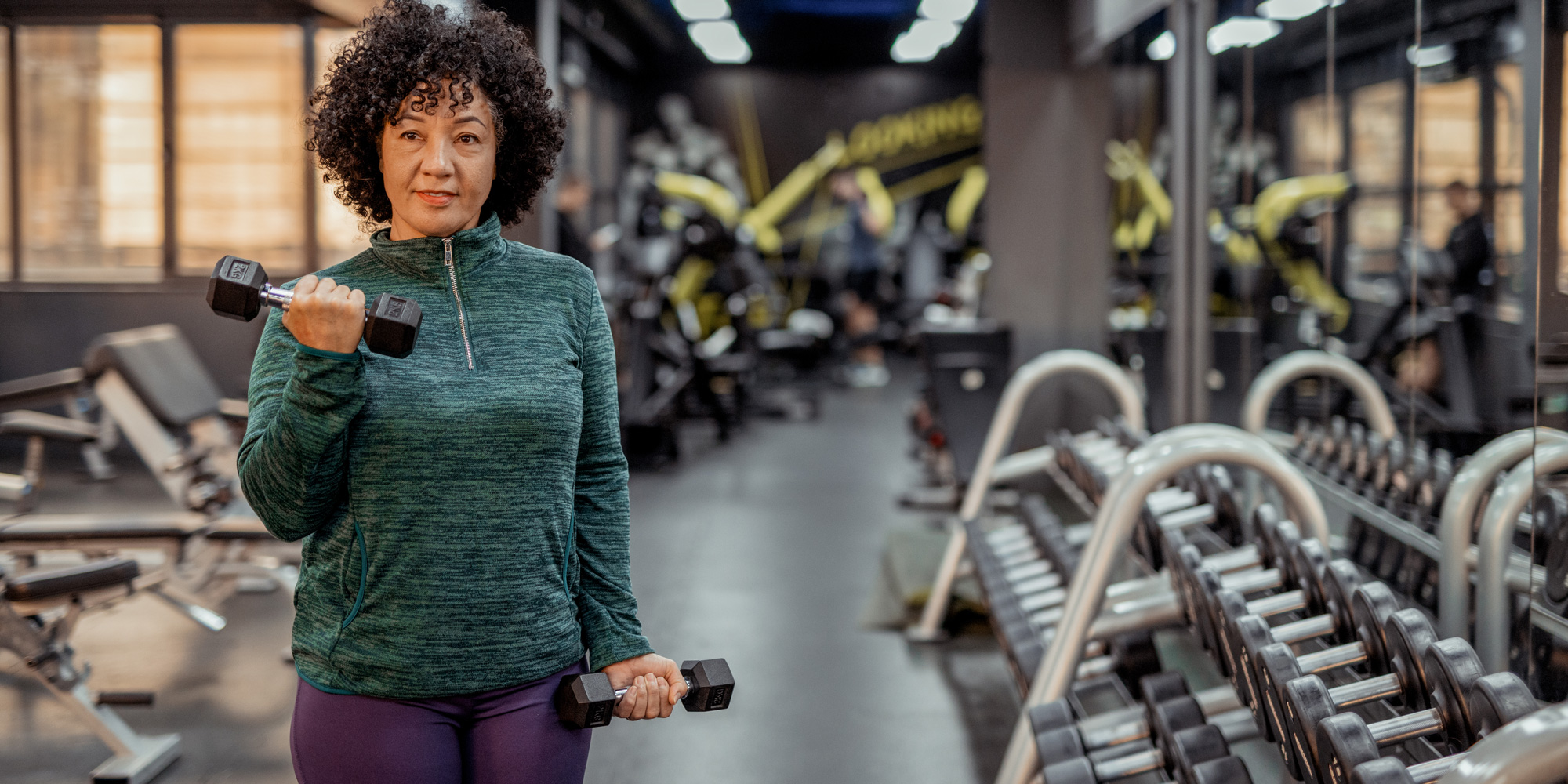mid life woman training exercise in gym