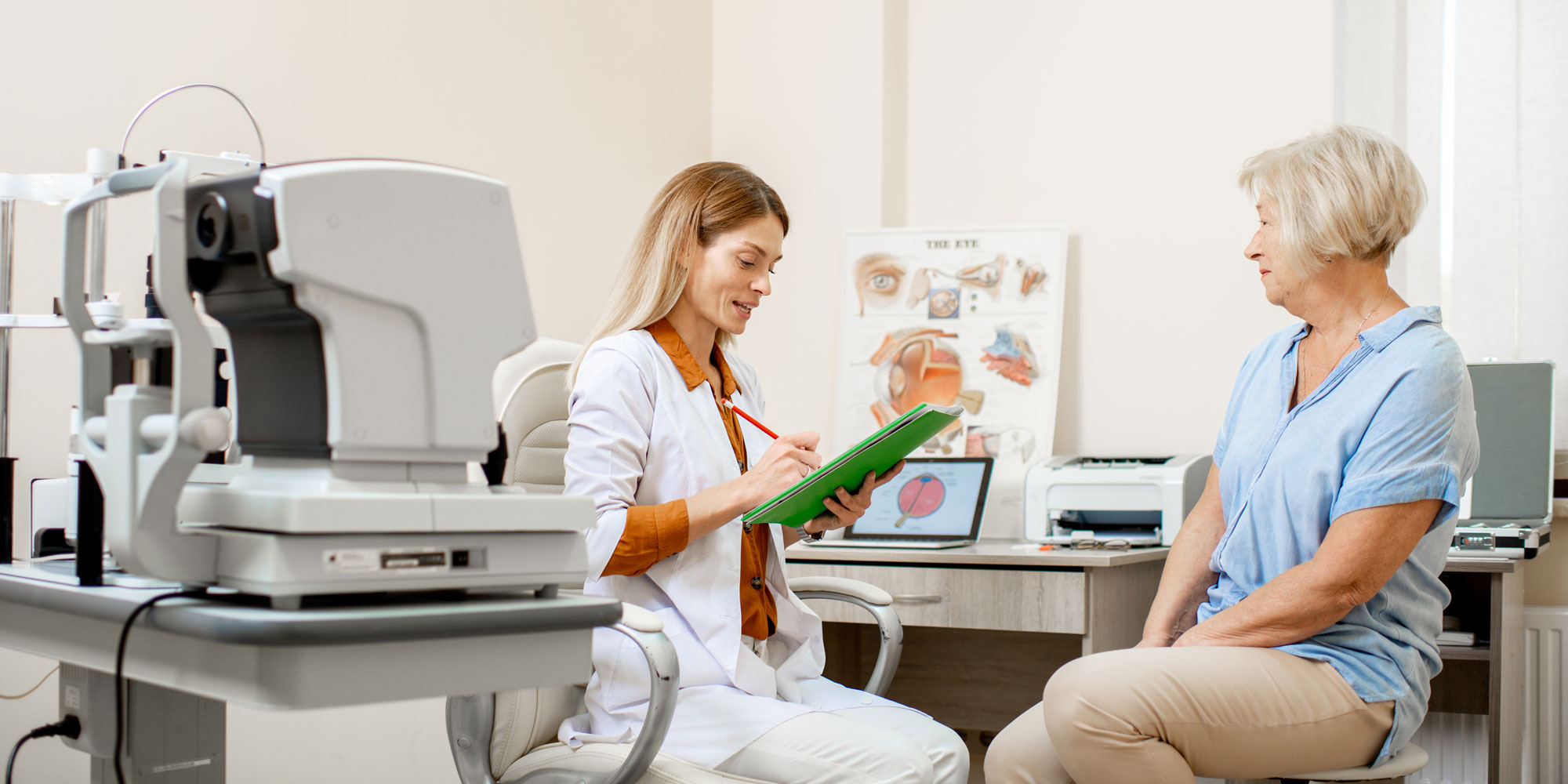 Two women, one a doctor and one a patient, in a consultation about laser eye surgery